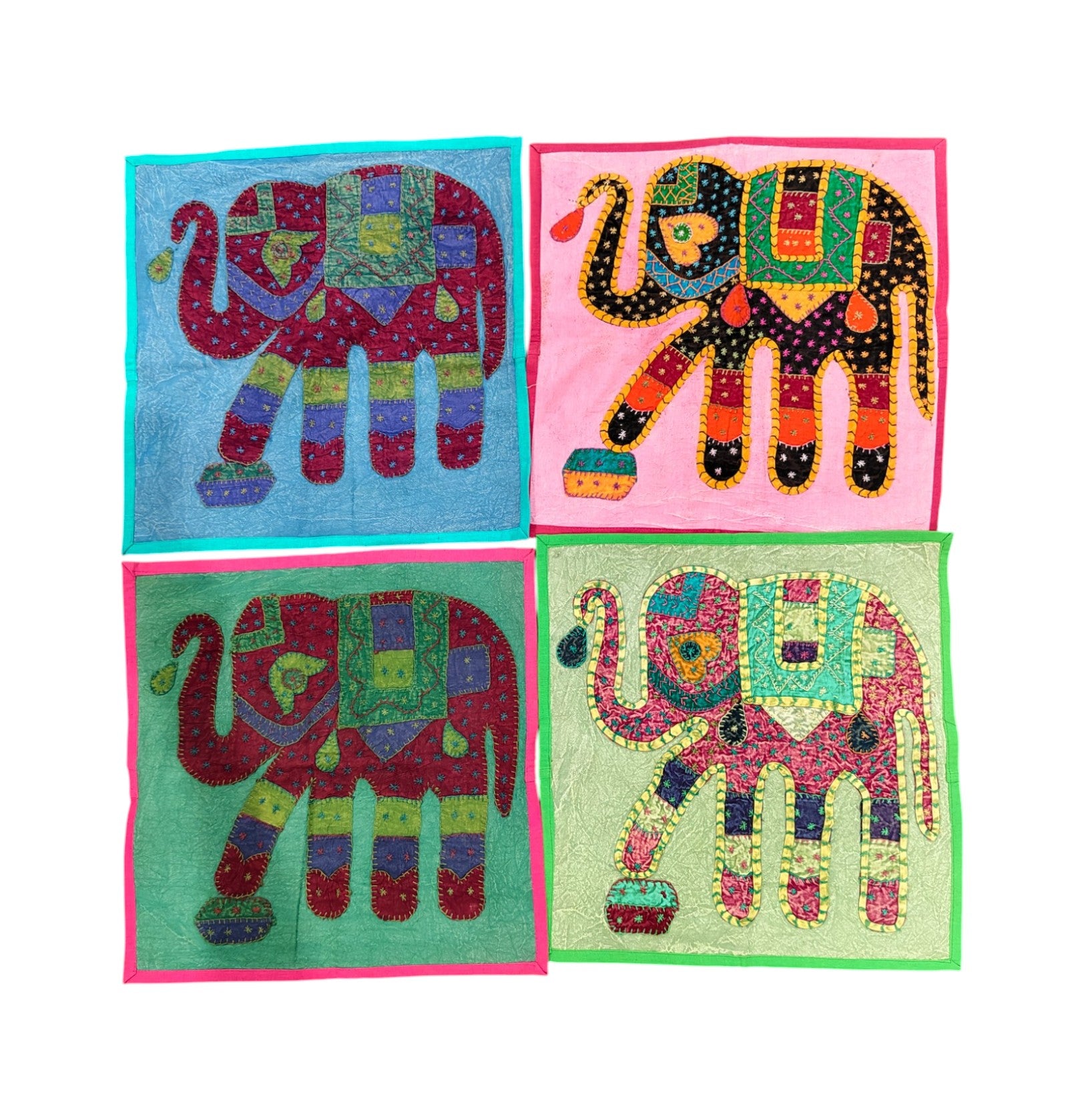 Set of 4 colorful elephant-patterned cushion covers featuring ethnic patchwork design, ideal for sofa or bedroom decor.