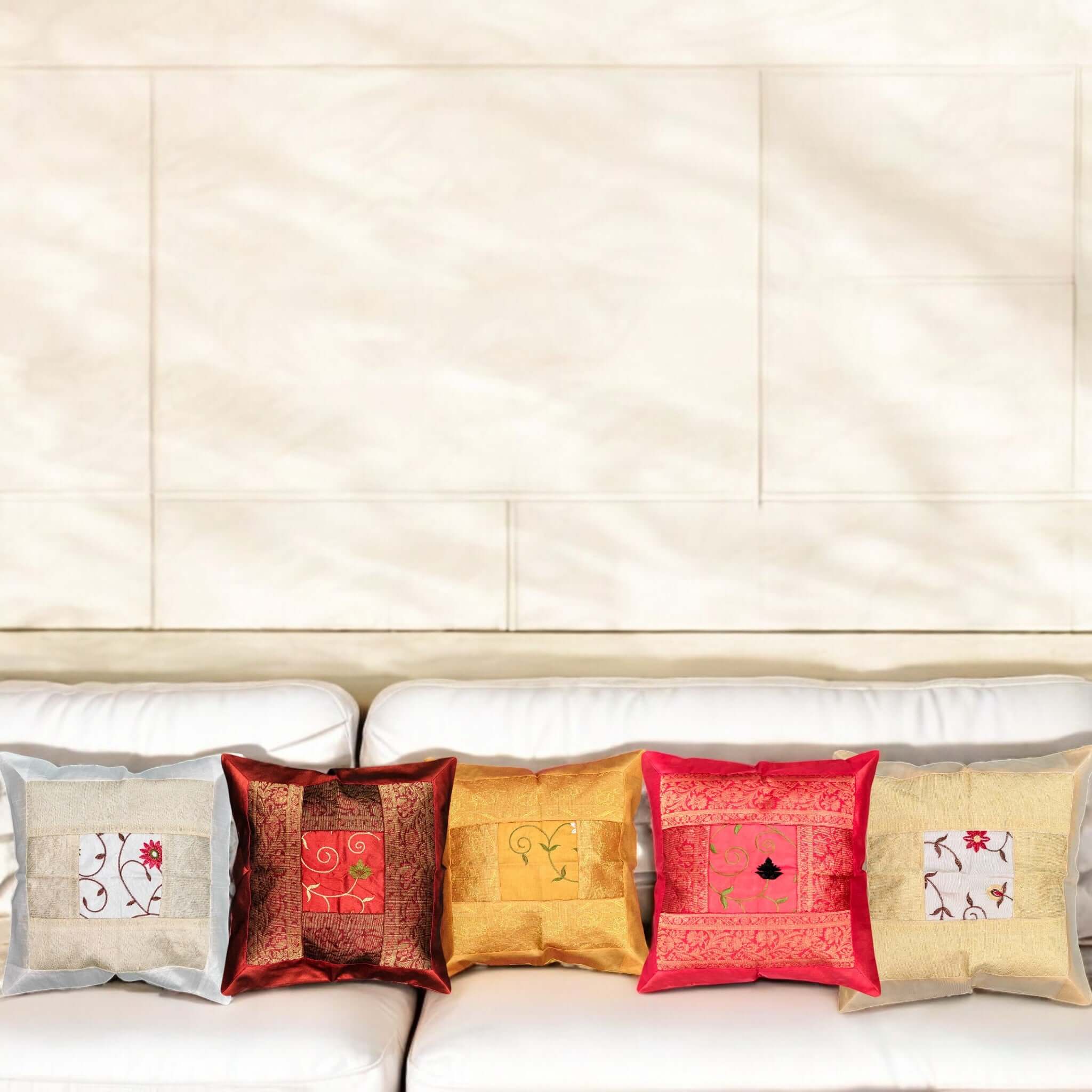 Banarasi Silk Brocade Cushion Covers Set of 5 displayed on a couch with an elegant backdrop.