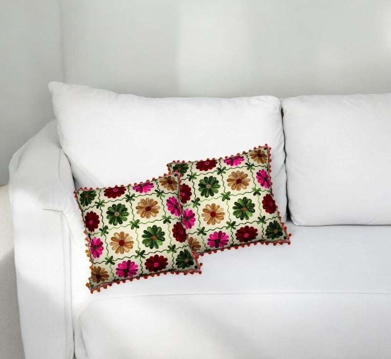 Set of 2 vibrant Indian patchwork cushion covers on a white sofa, perfect decorative pillows for any living space.