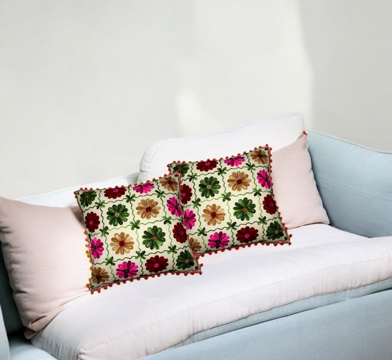 Set of 2 vibrant Indian patchwork cushion covers on a sofa, perfect for decorative accents in living spaces.