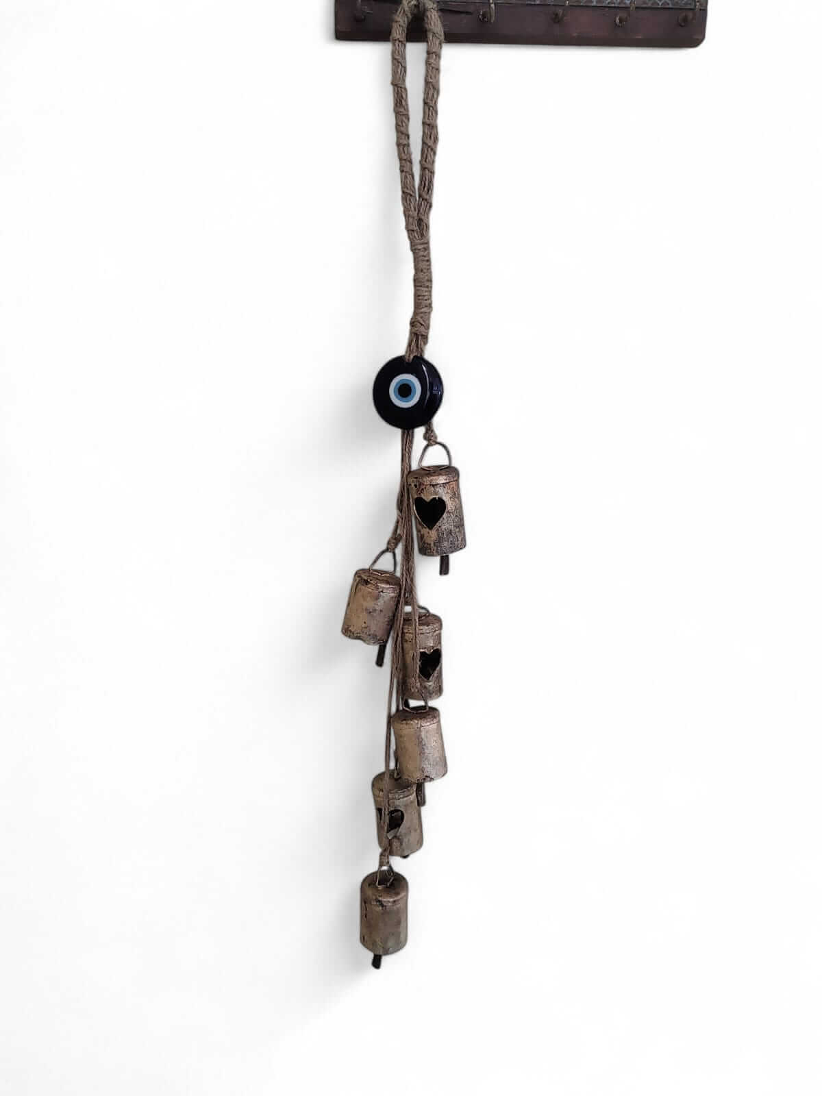 rustic christmas bells hanging with blue evil eye beads for protection and charm