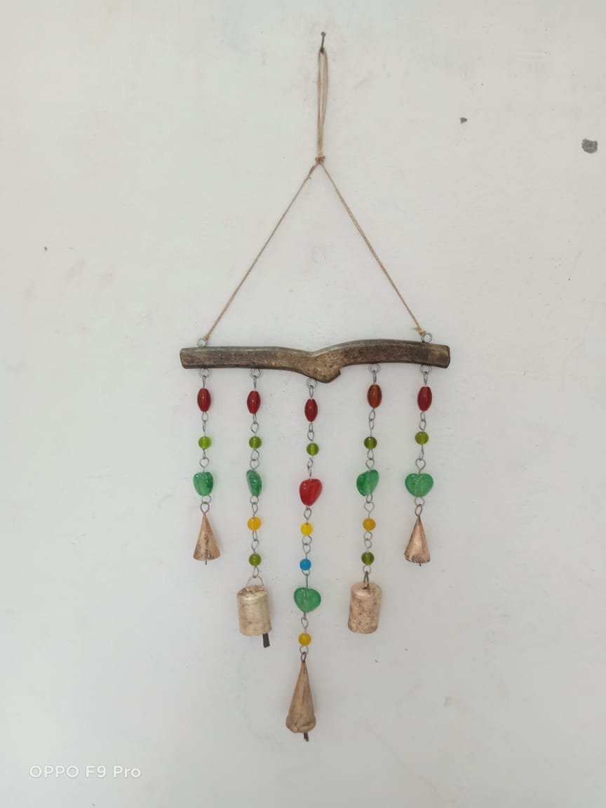 Handmade bohemian hanging chime bells with colorful beads for garden or indoor decor, crafted in India.