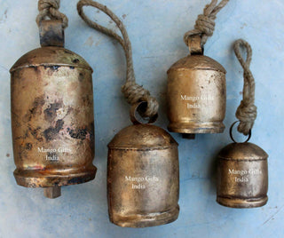 Set of 4 antique rustic cow bells with jute rope, handcrafted vintage style, perfect for garden decor.