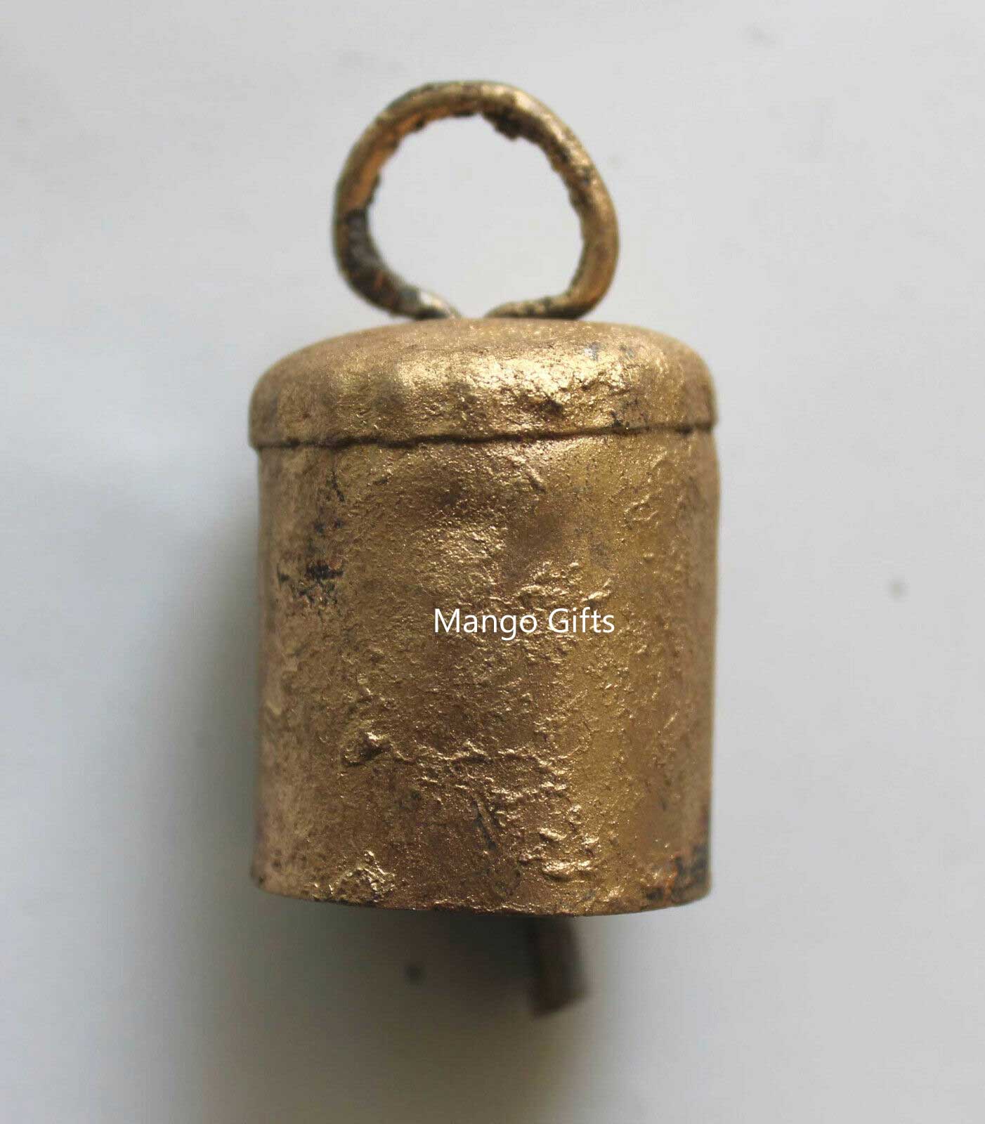 Handmade Indian cowbell in rustic golden color, crafted from recycled iron with a unique rough texture.