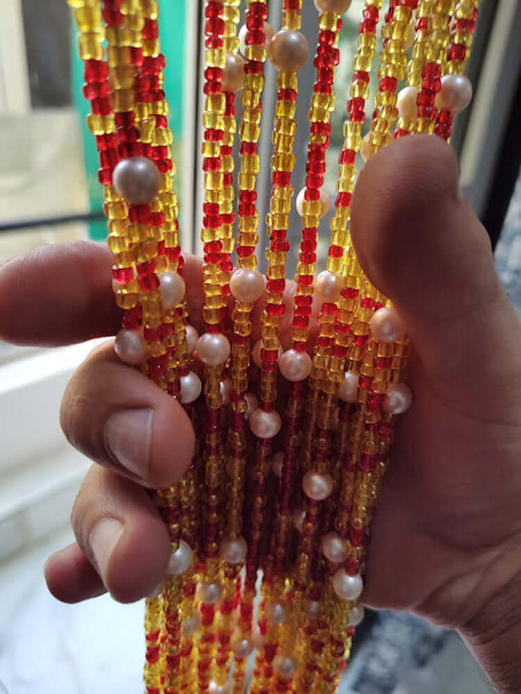 Handmade colorful glass bead strands with jingle bells—perfect for doorways or wall décor. Eco-friendly and crafted by women's artisans in India.