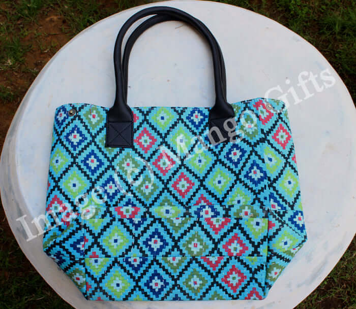 Stylish blue geometric cotton Kantha tote bag with leather straps and zip closure, perfect for shopping or picnics.