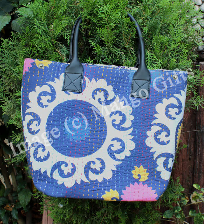 Blue cotton Kantha tote bag with leather straps and floral patterns, perfect for shopping and picnics.