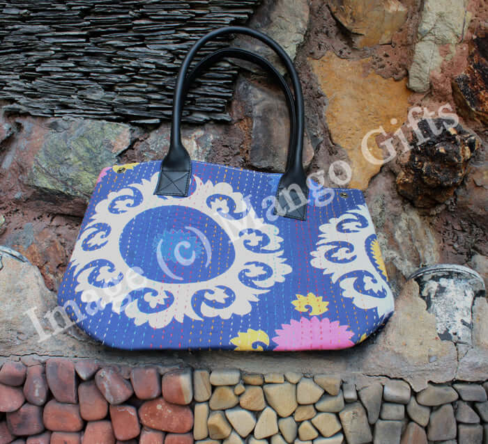 Stylish blue cotton Kantha tote bag with leather straps, perfect for shopping or picnics, handmade in India.