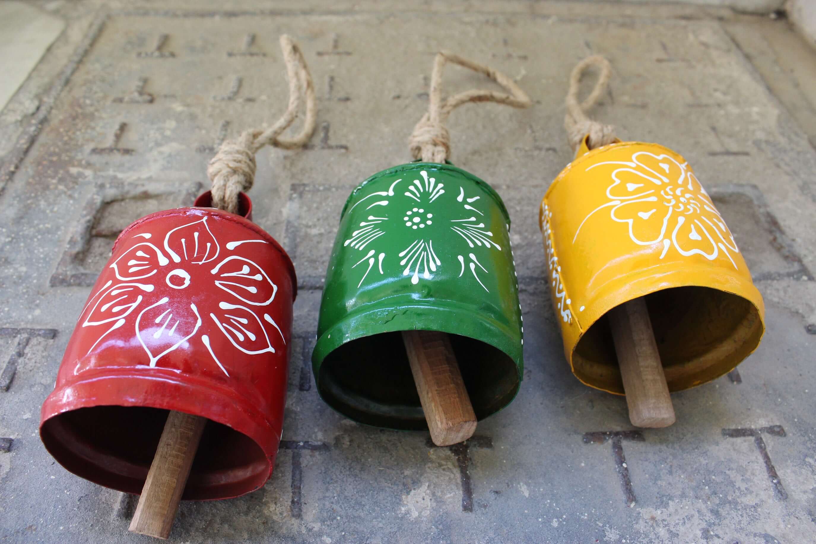 Shop our 3-piece hand-painted harmony bells set! Made from recycled iron, these colorful bells create soothing sounds for home décor.