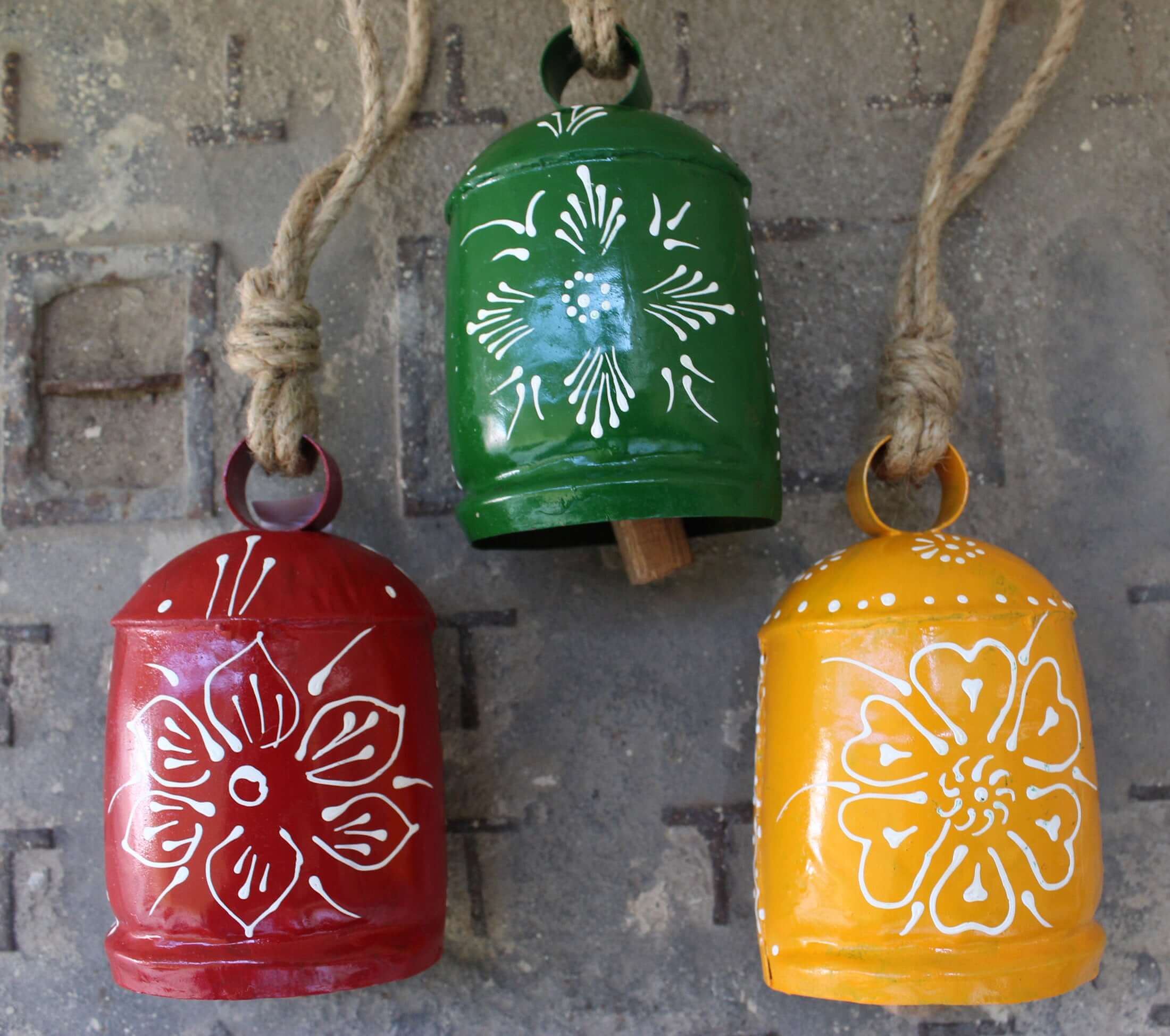 Shop our 3-piece hand-painted harmony bells set! Made from recycled iron, these colorful bells create soothing sounds for home décor.
