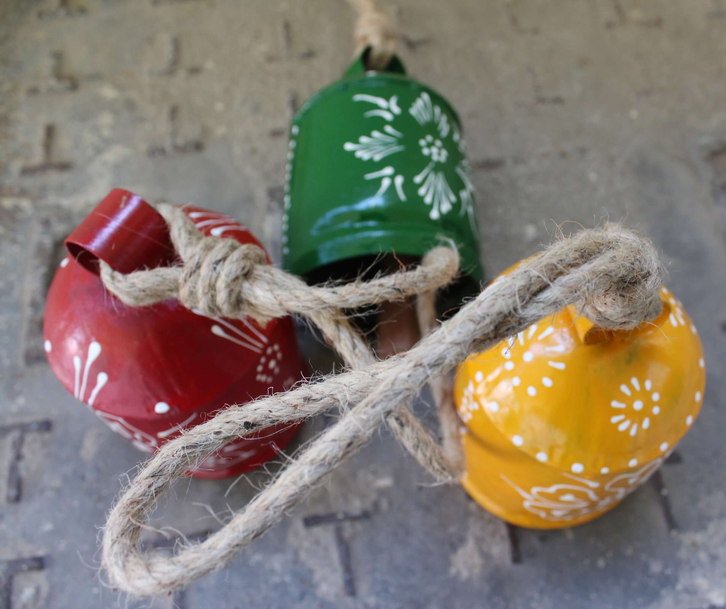 Shop our 3-piece hand-painted harmony bells set! Made from recycled iron, these colorful bells create soothing sounds for home décor.
