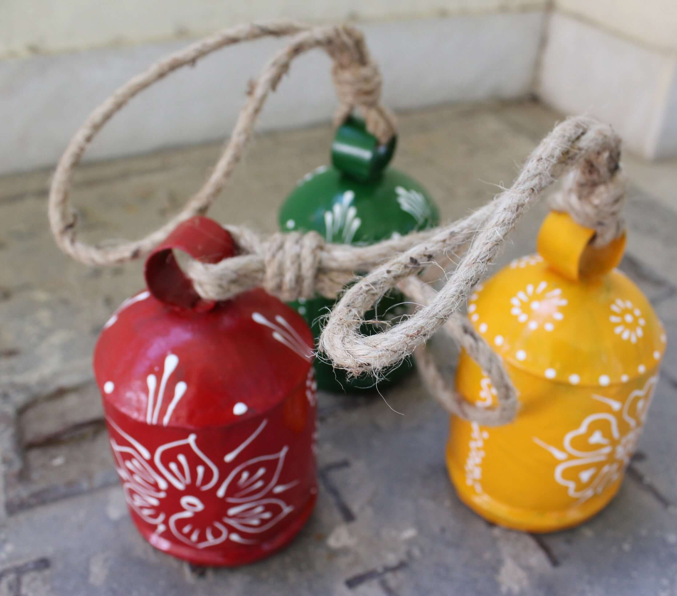 Shop our 3-piece hand-painted harmony bells set! Made from recycled iron, these colorful bells create soothing sounds for home décor.