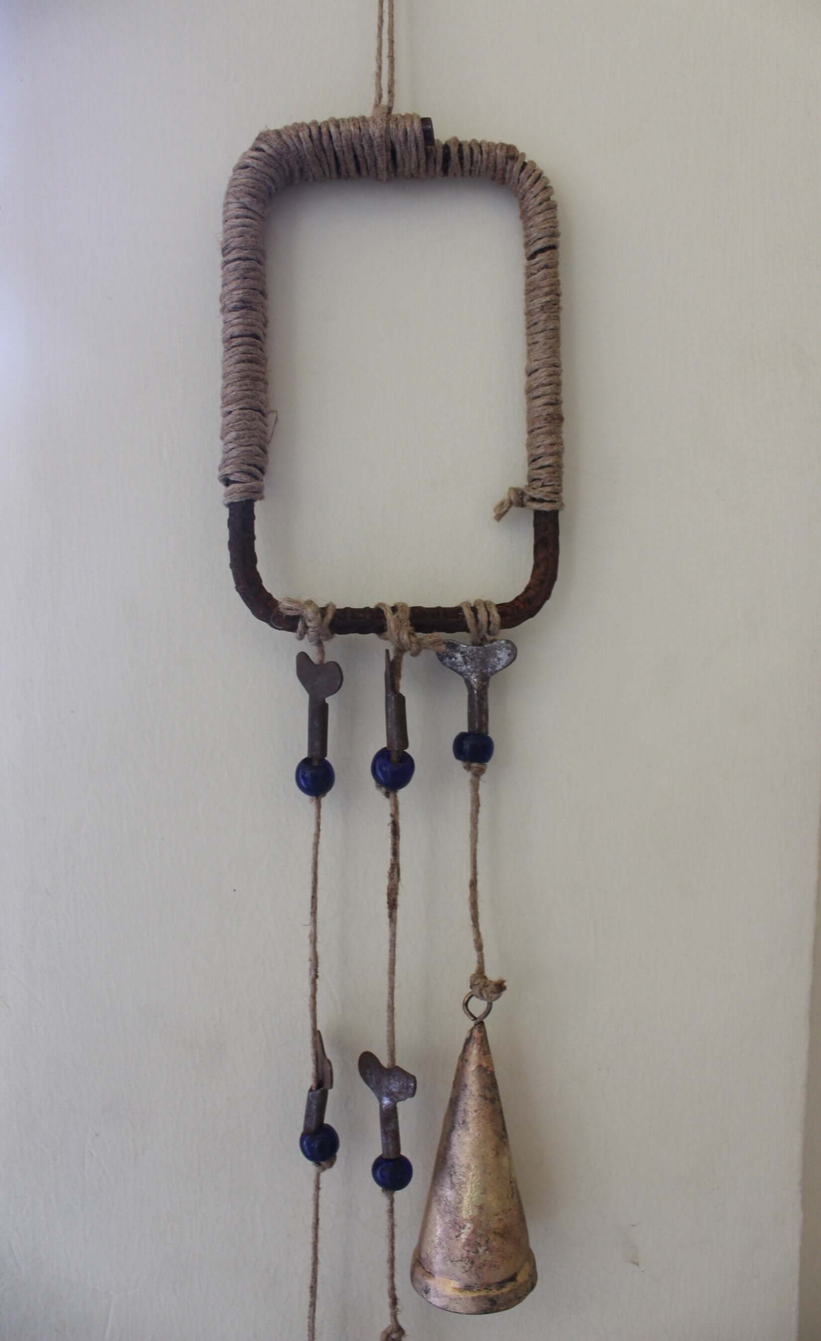 Enhance your Halloween with our handmade Witches Bells. Crafted from recycled materials, these rustic chimes bring protection and charm.