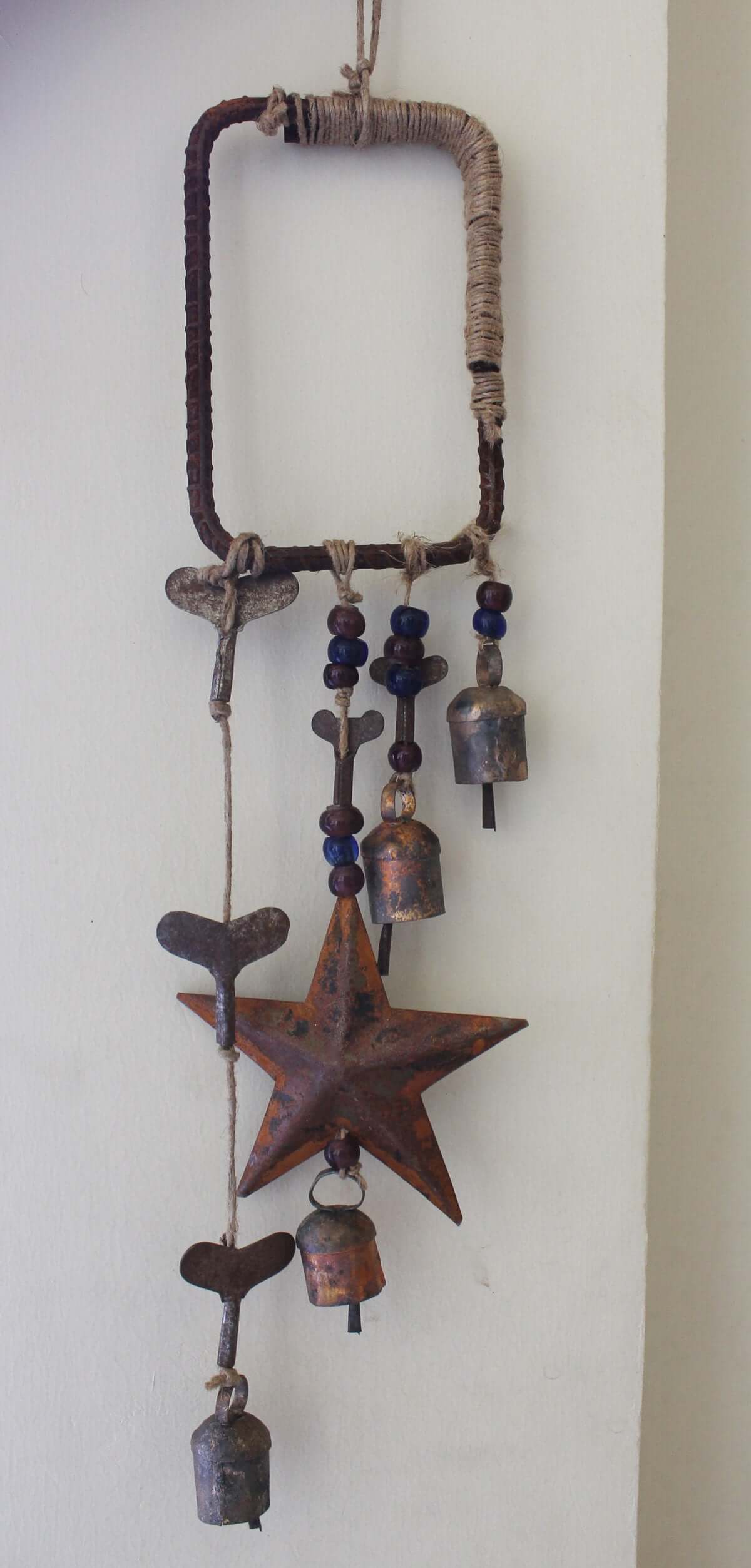 Enhance your Halloween with our handmade Witches Bells. Crafted from recycled materials, these rustic chimes bring protection and charm.