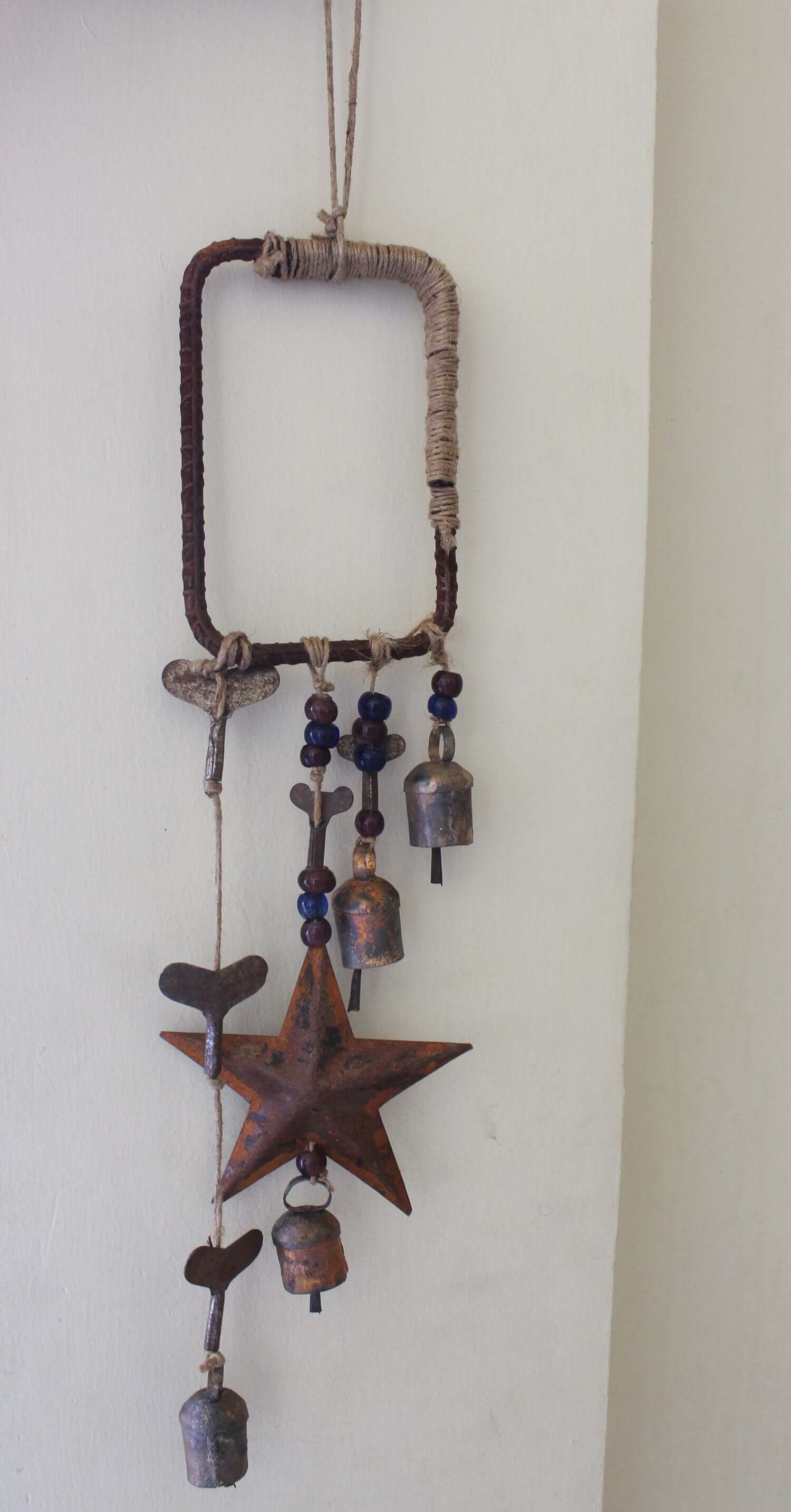 Enhance your Halloween with our handmade Witches Bells. Crafted from recycled materials, these rustic chimes bring protection and charm.