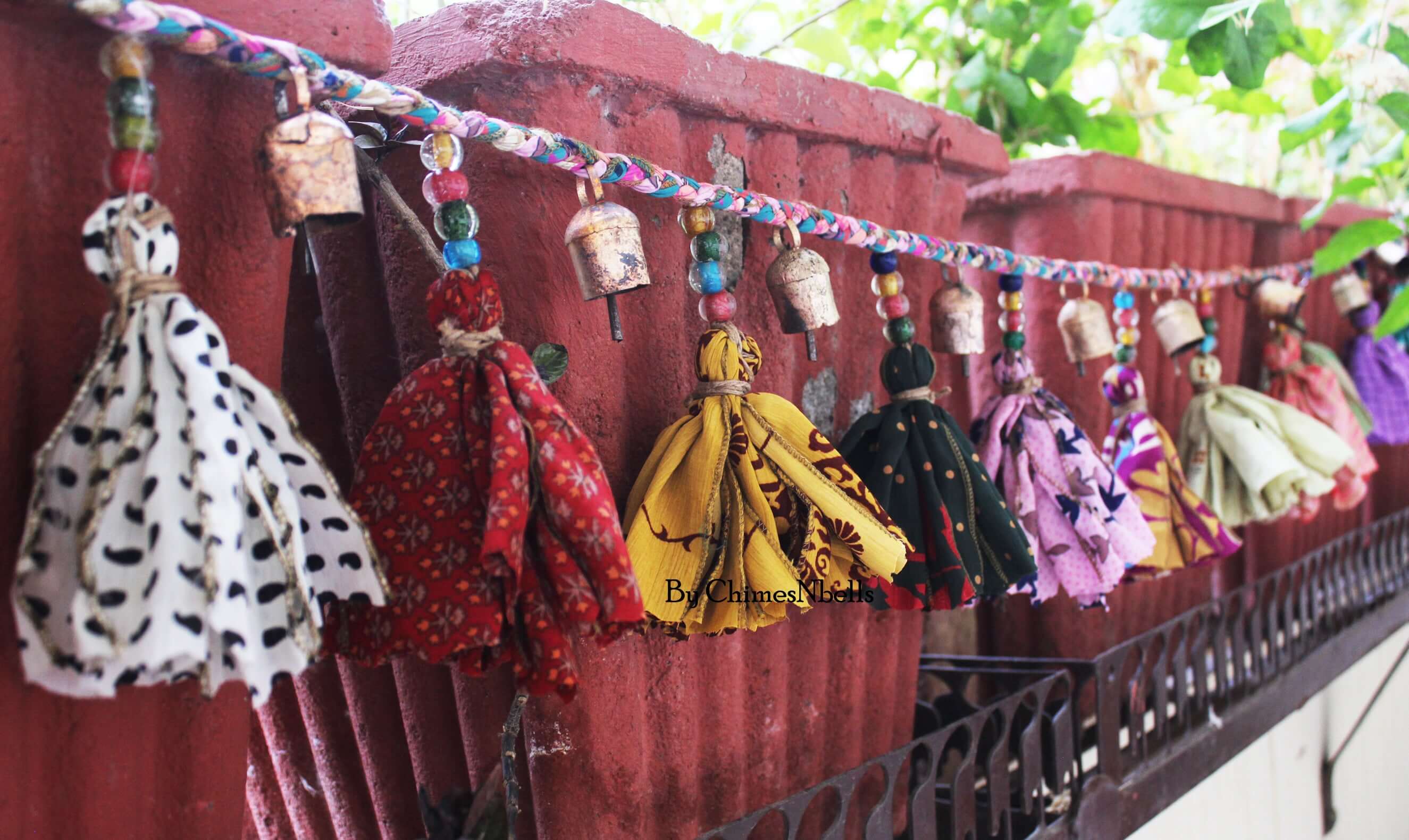 Adorn your space with this 5ft handmade garland of brass bells and glass beads. Perfect for parties and home decoration.