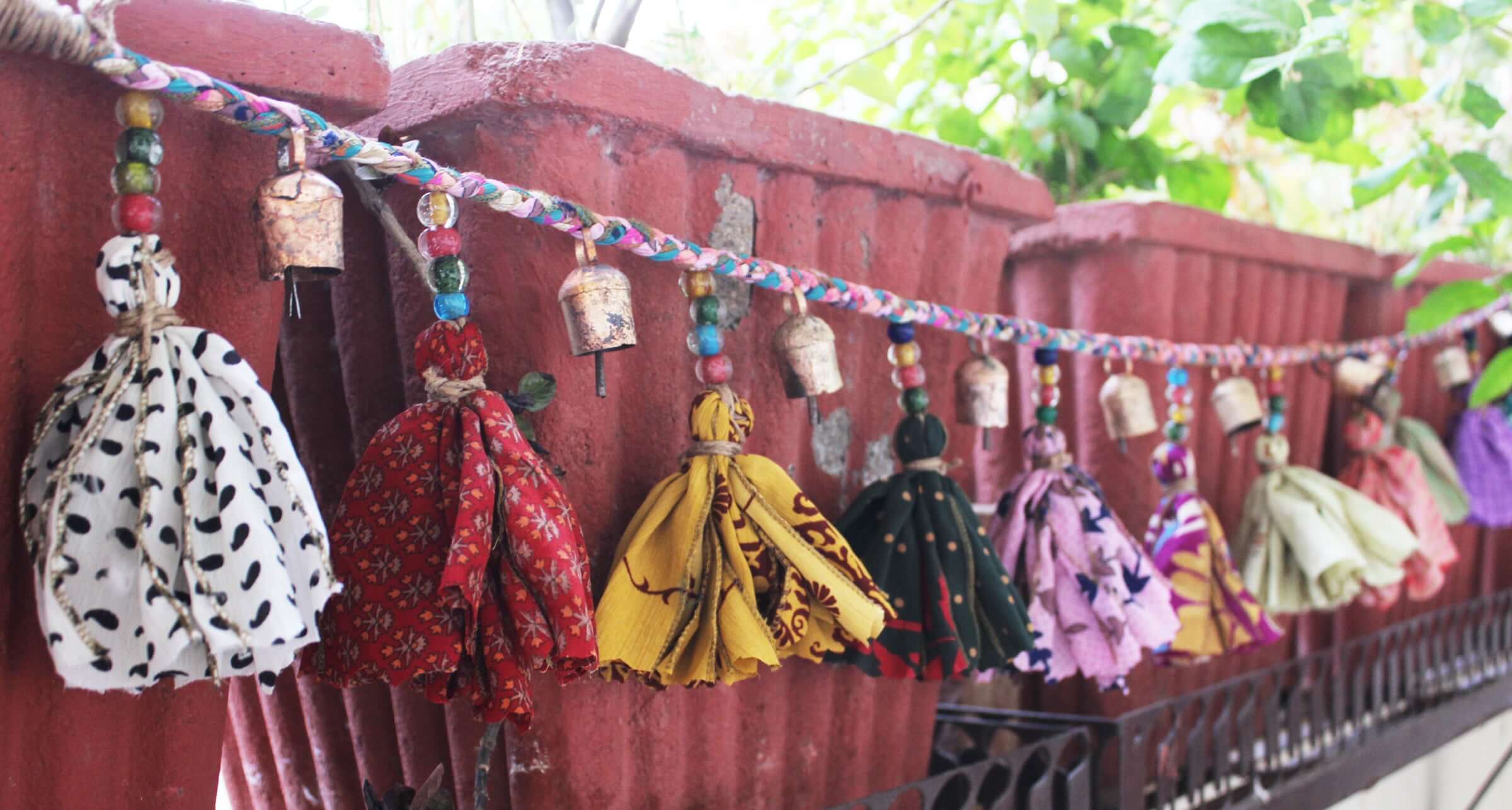 Adorn your space with this 5ft handmade garland of brass bells and glass beads. Perfect for parties and home decoration.