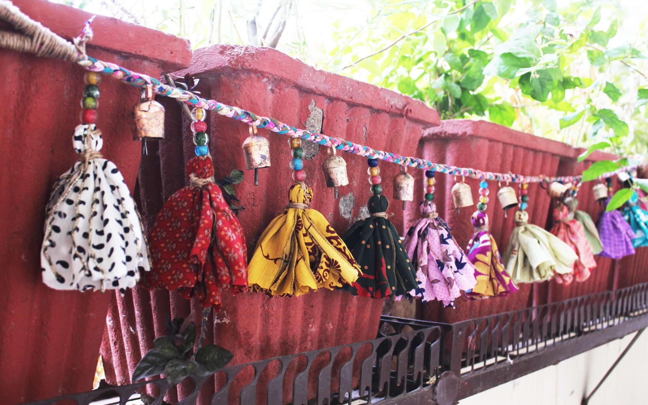 Adorn your space with this 5ft handmade garland of brass bells and glass beads. Perfect for parties and home decoration.