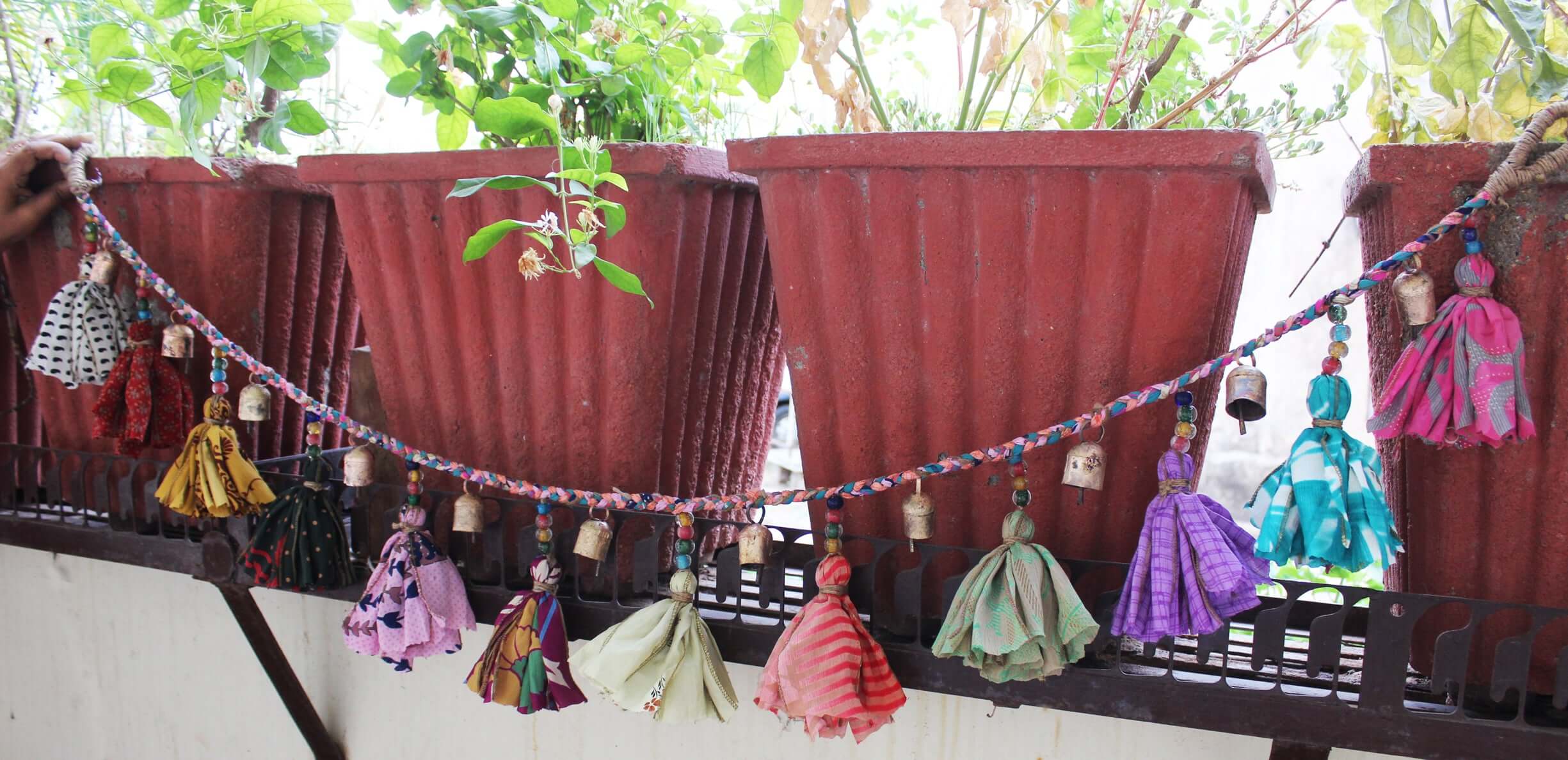 Adorn your space with this 5ft handmade garland of brass bells and glass beads. Perfect for parties and home decoration.