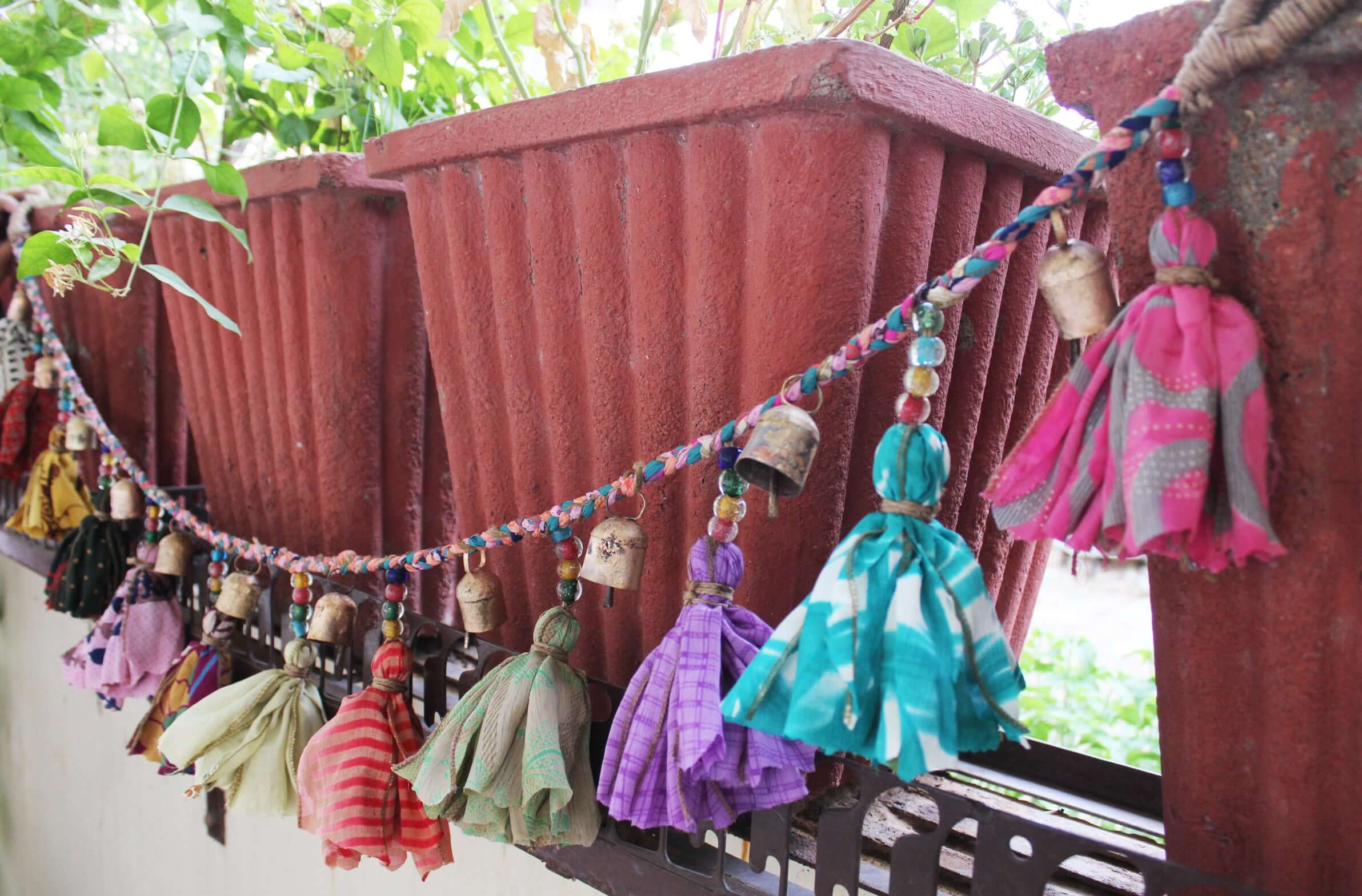 Adorn your space with this 5ft handmade garland of brass bells and glass beads. Perfect for parties and home decoration.