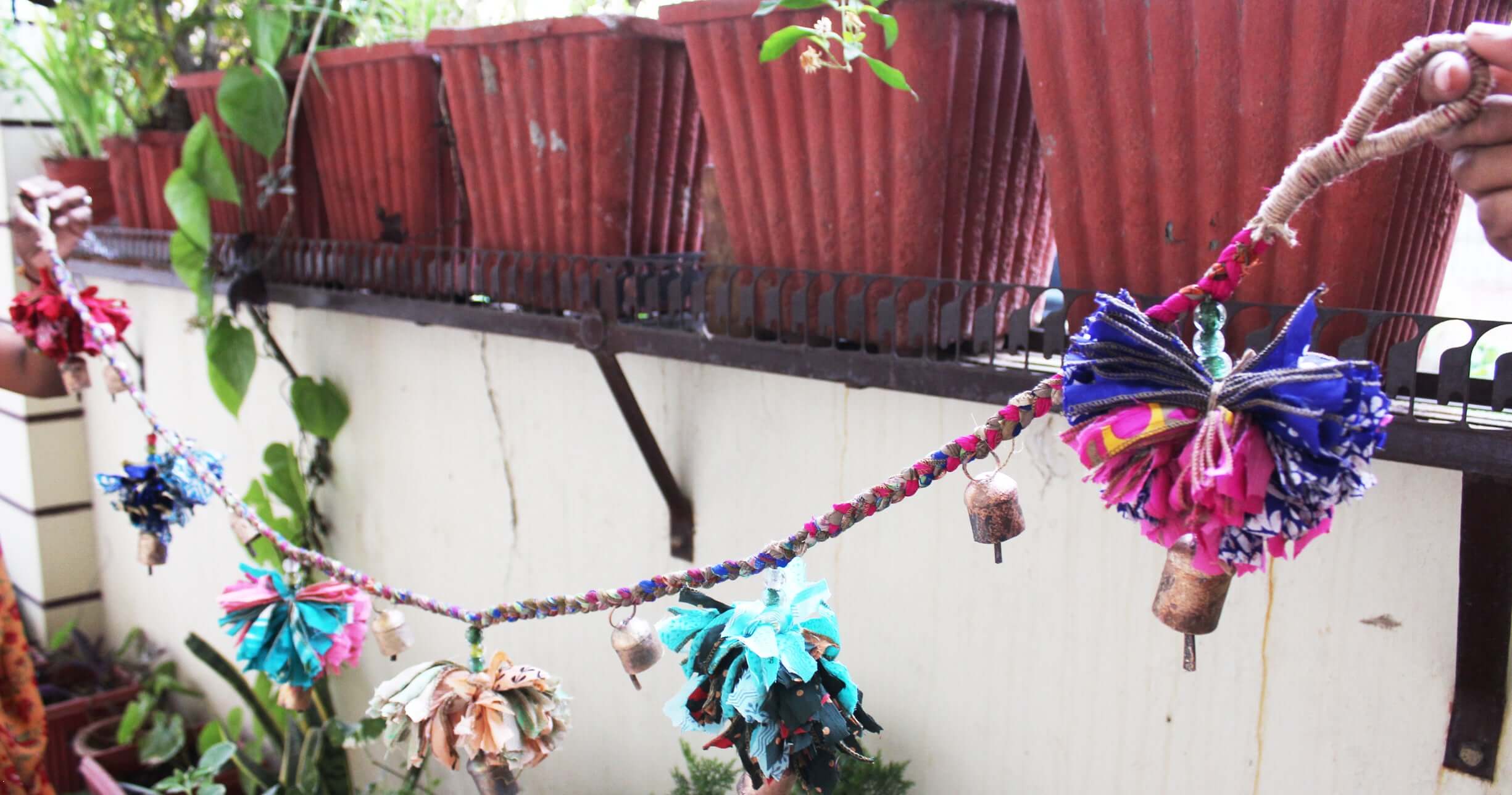 Adorn your space with this 5ft handmade garland of brass bells and glass beads. Perfect for parties and home decoration.