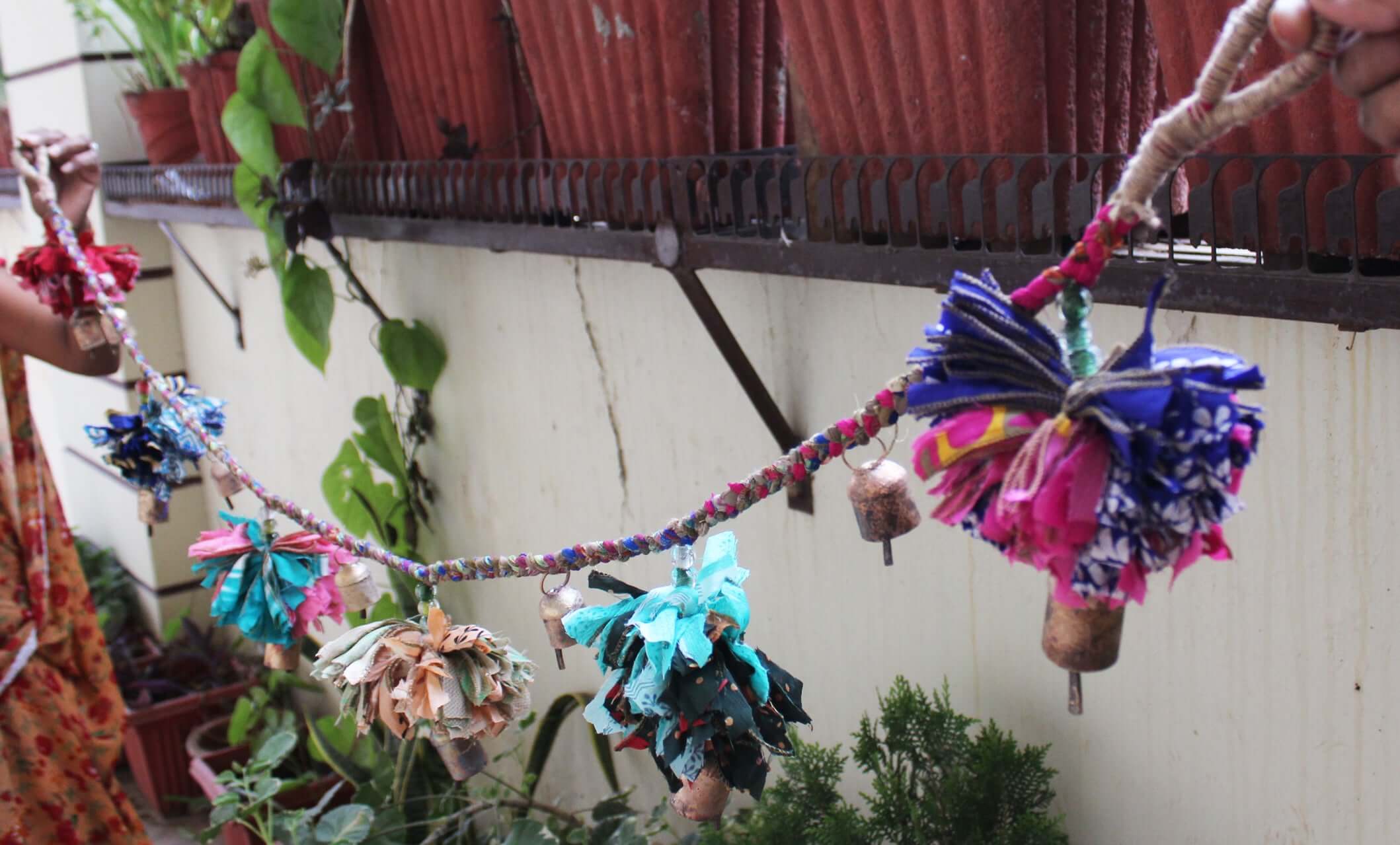 Adorn your space with this 5ft handmade garland of brass bells and glass beads. Perfect for parties and home decoration.