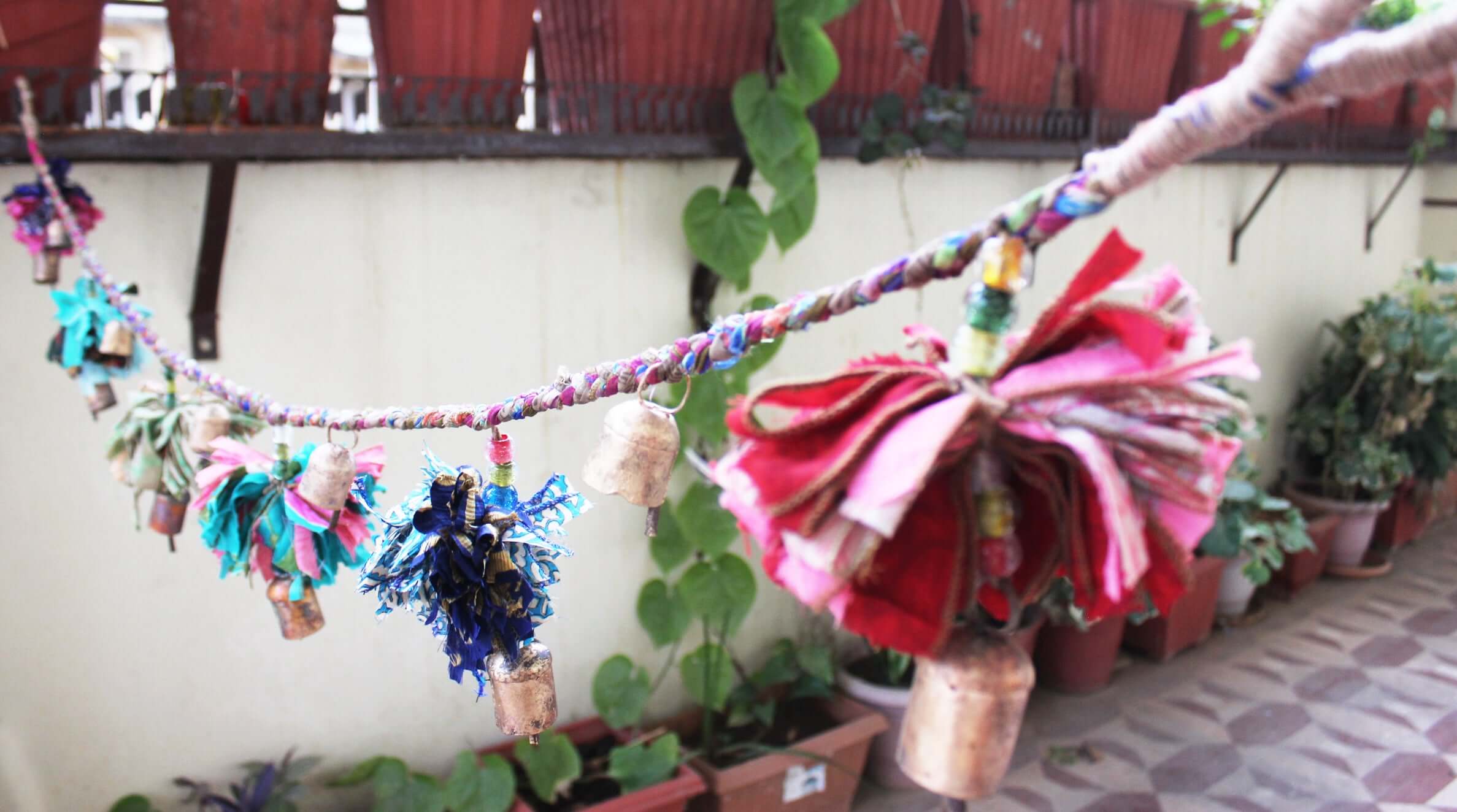 Adorn your space with this 5ft handmade garland of brass bells and glass beads. Perfect for parties and home decoration.
