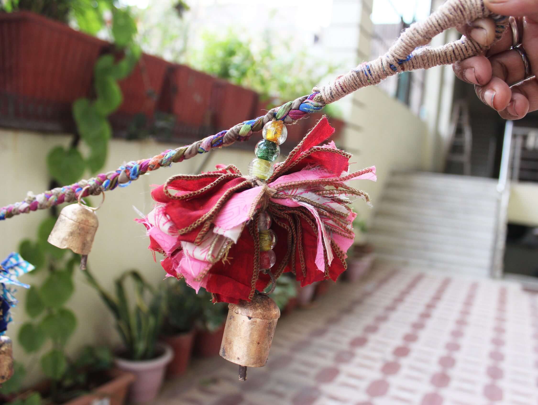Adorn your space with this 5ft handmade garland of brass bells and glass beads. Perfect for parties and home decoration.
