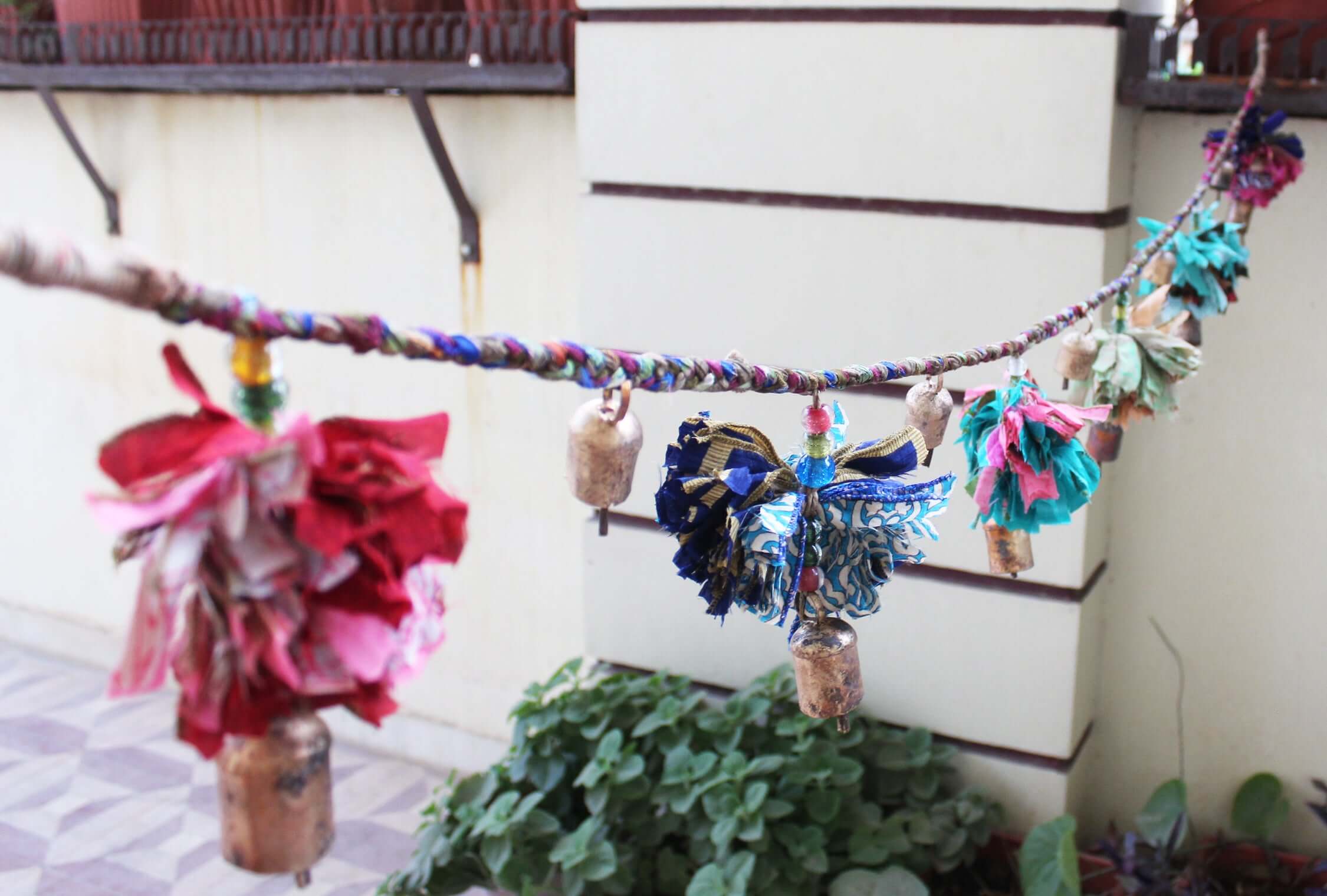 Adorn your space with this 5ft handmade garland of brass bells and glass beads. Perfect for parties and home decoration.