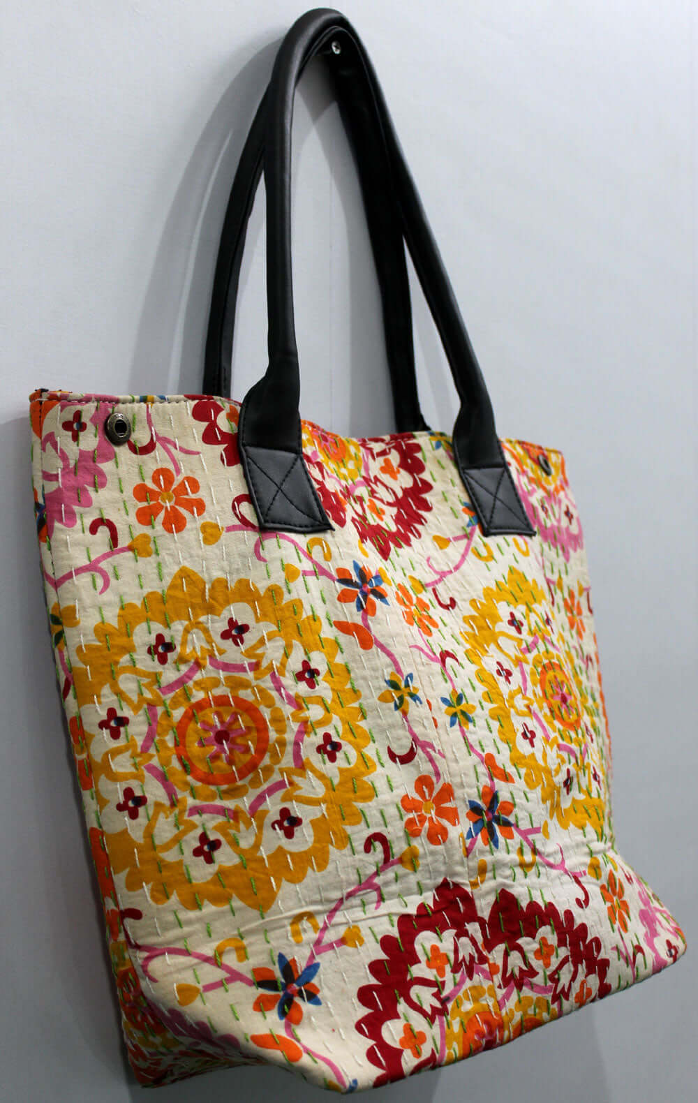 Chakra design tote bag with vibrant floral patterns, handmade cotton material and leather straps, ideal for shopping and picnics.
