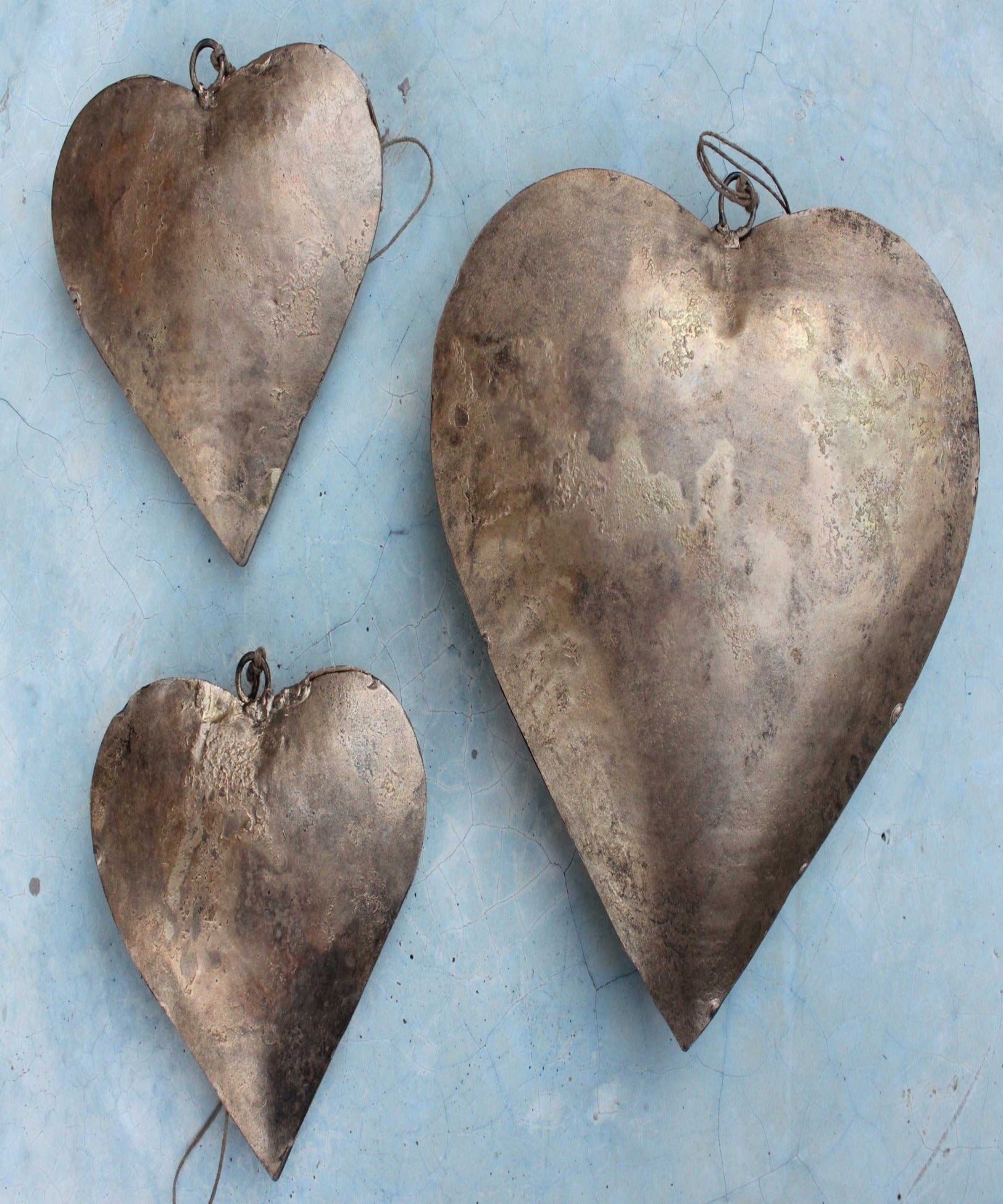 Handmade Indian metal crafts. Large, charming heart hangings made from recycled iron—perfect love gifts for weddings.
