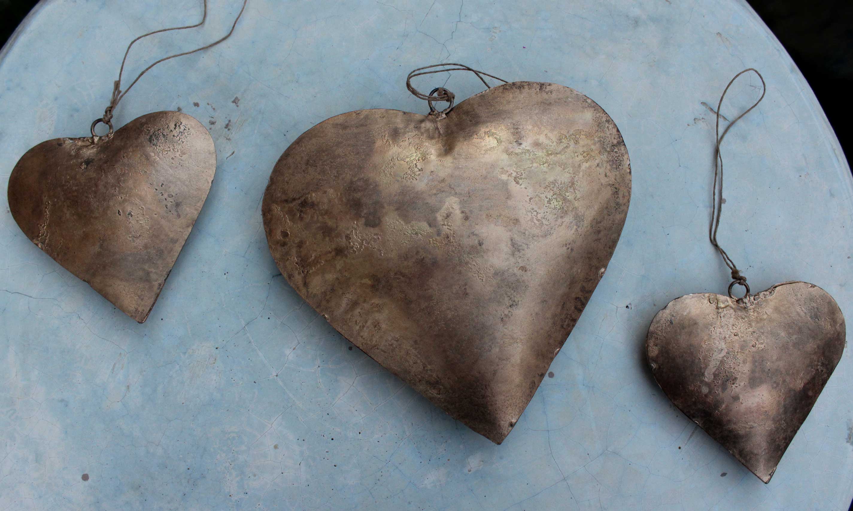 Handmade Indian metal crafts. Large, charming heart hangings made from recycled iron—perfect love gifts for weddings.