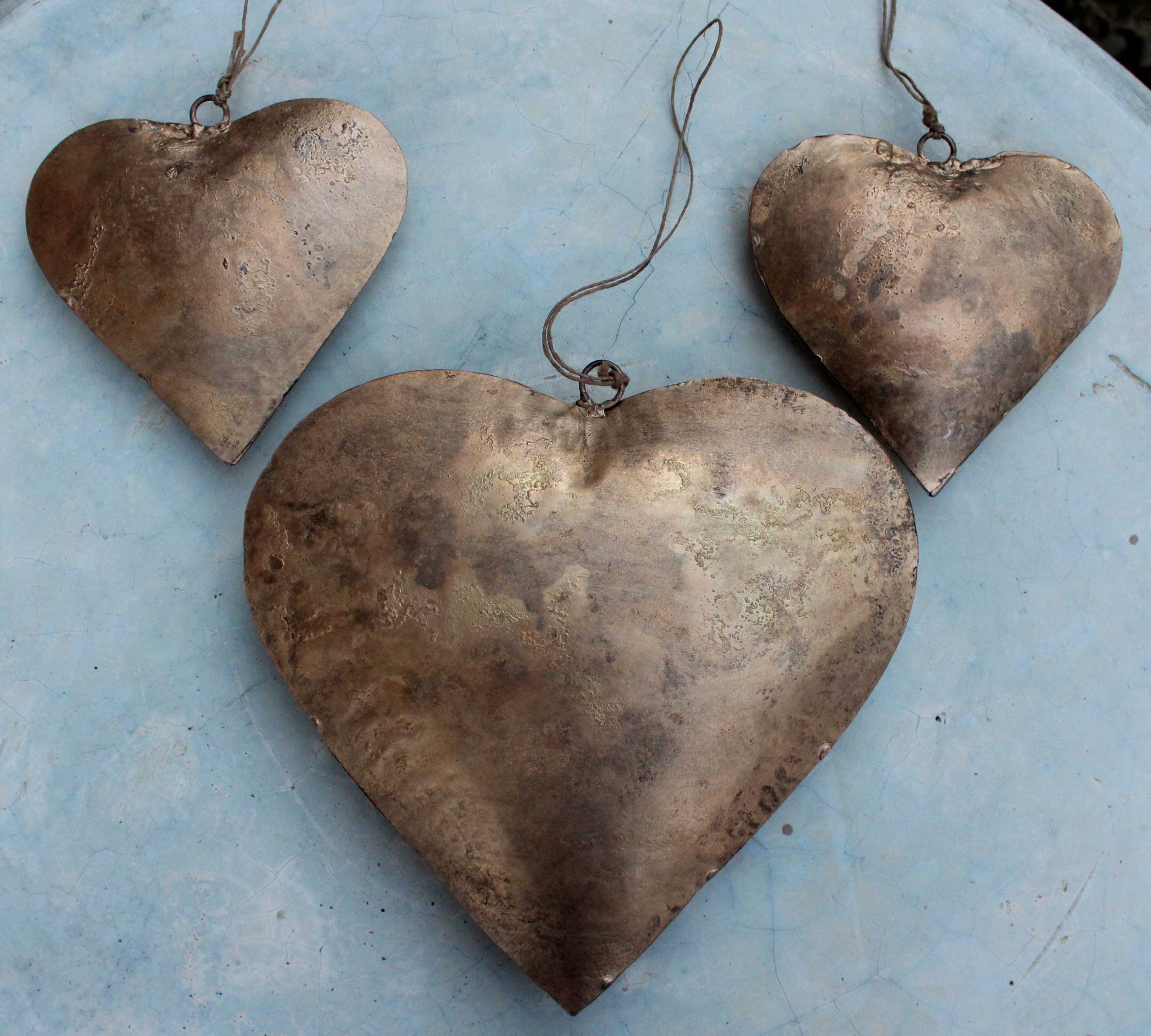 Handmade Indian metal crafts. Large, charming heart hangings made from recycled iron—perfect love gifts for weddings.