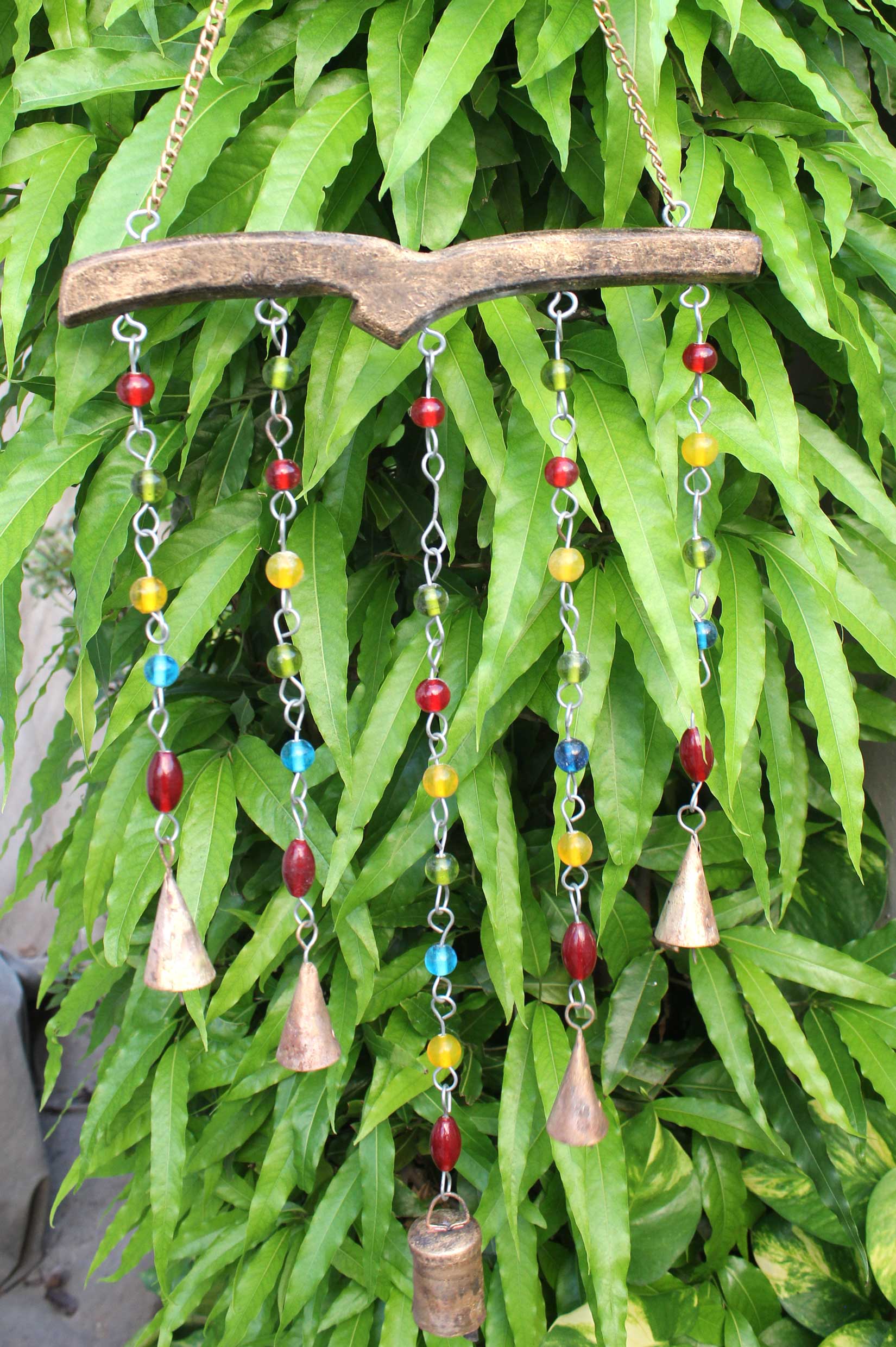 Handmade bohemian hanging chime bells and beads decoration for garden, patio, indoor, and outdoor use.