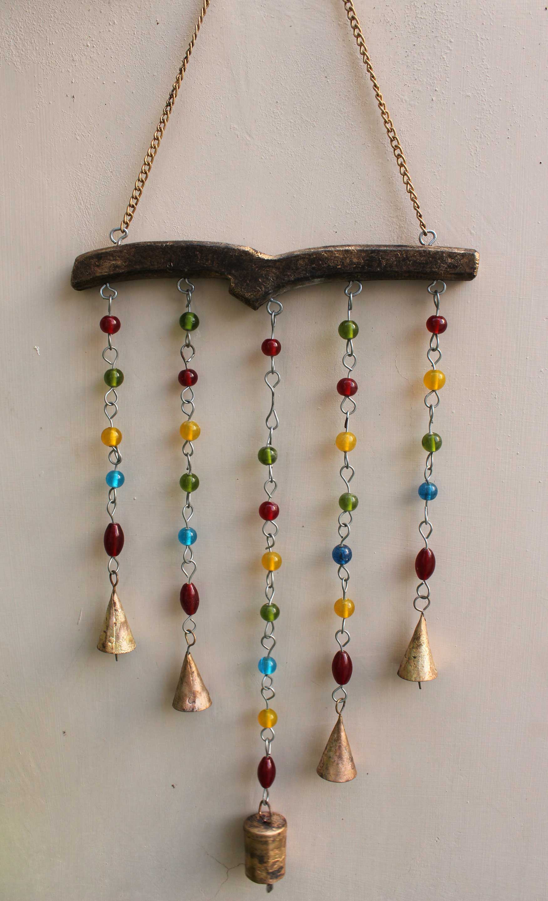 Handmade hanging chime bells with colorful beads for garden and indoor decor, Bohemian style, crafted in India.