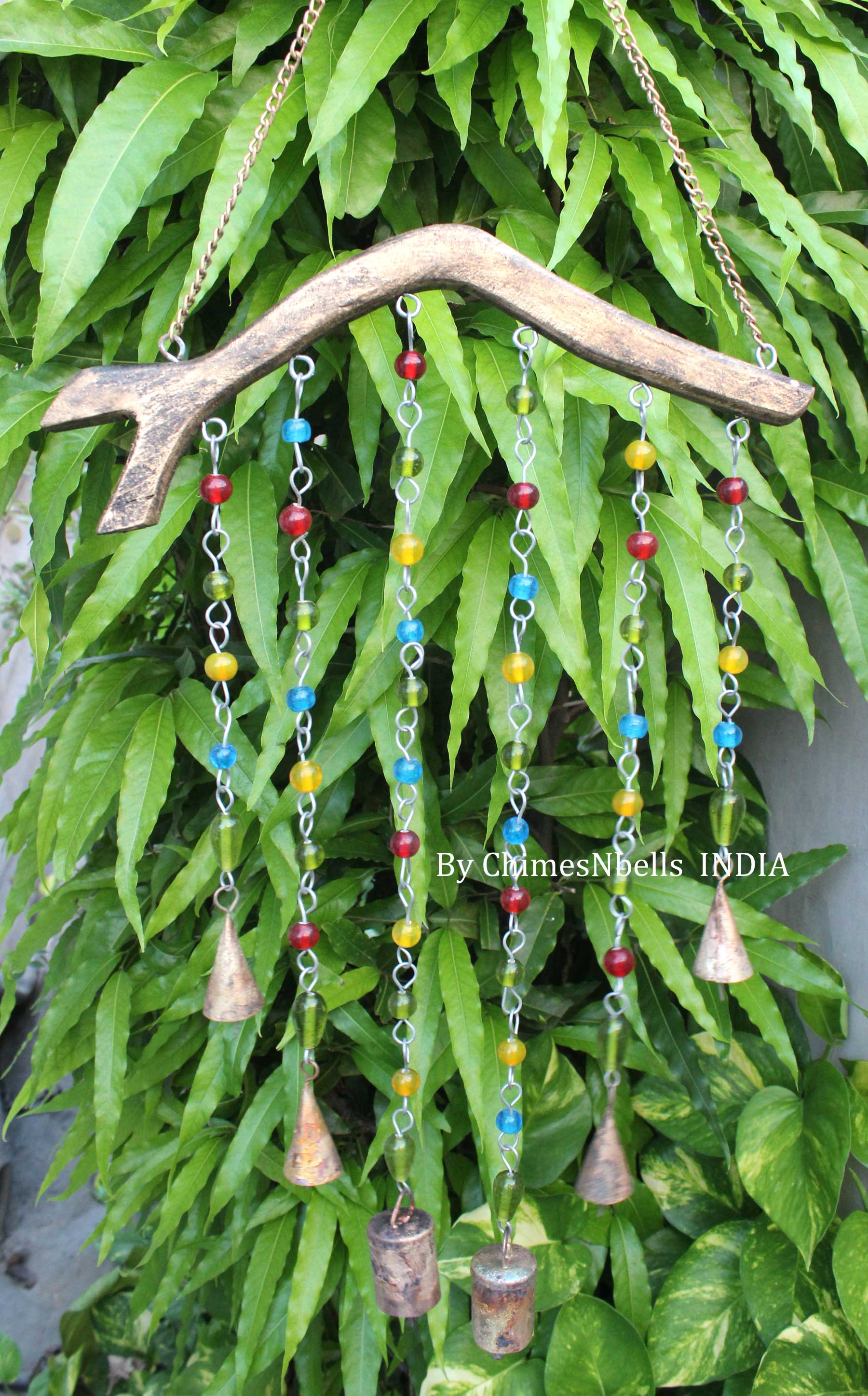 Handmade garden chime bells with colorful beads and wood, perfect for indoor and outdoor decoration, crafted in India.