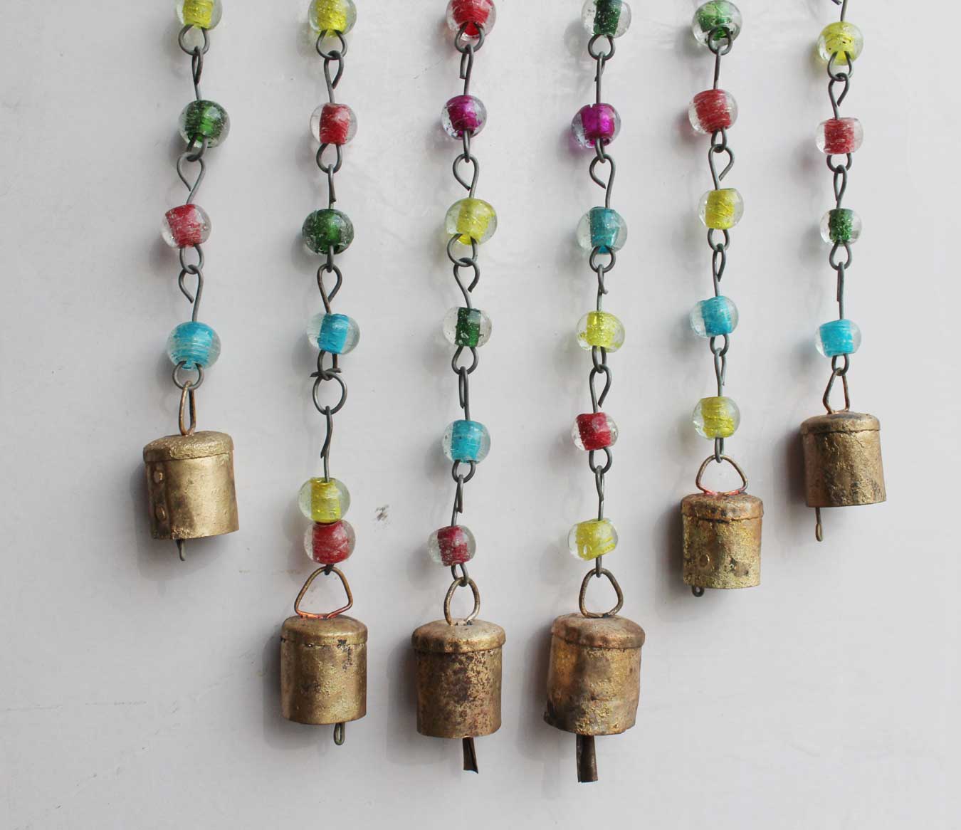 Discover our unique beaded iron windchime, ideal for any occasion. Handmade with love, this decorative piece is perfect for your space!