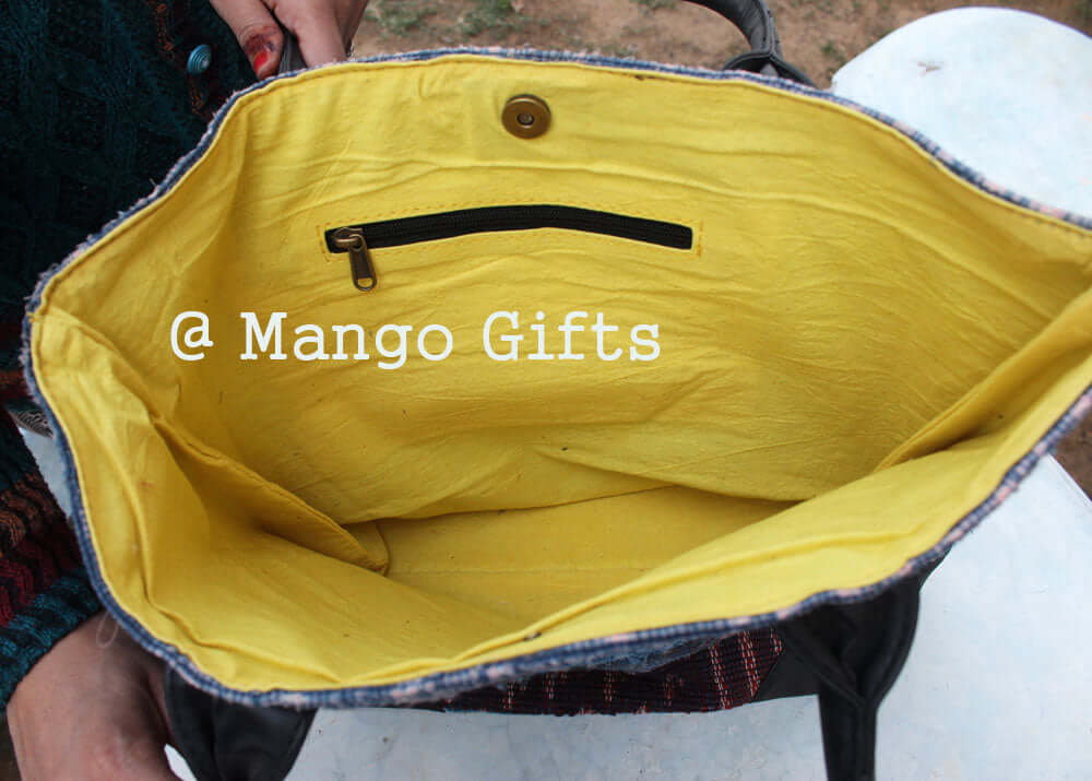 Inside view of the Chindi Rug Tote Bag with yellow lining and zipper pocket, handmade cotton shopping bag.