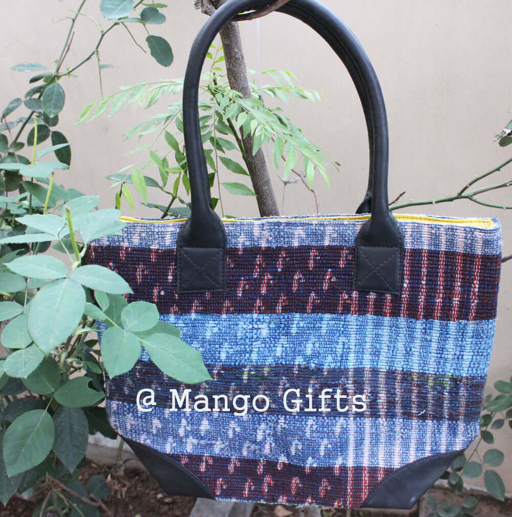 Chindi tote bag with colorful cotton kantha design and leather straps, perfect for shopping or picnics.