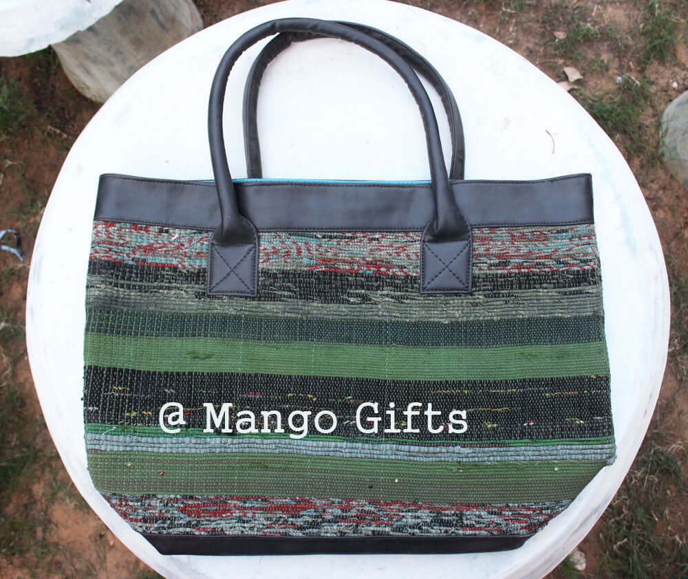 Handmade green chindi tote bag with leather straps, perfect for stylish shopping and picnics, by Mango Gifts.