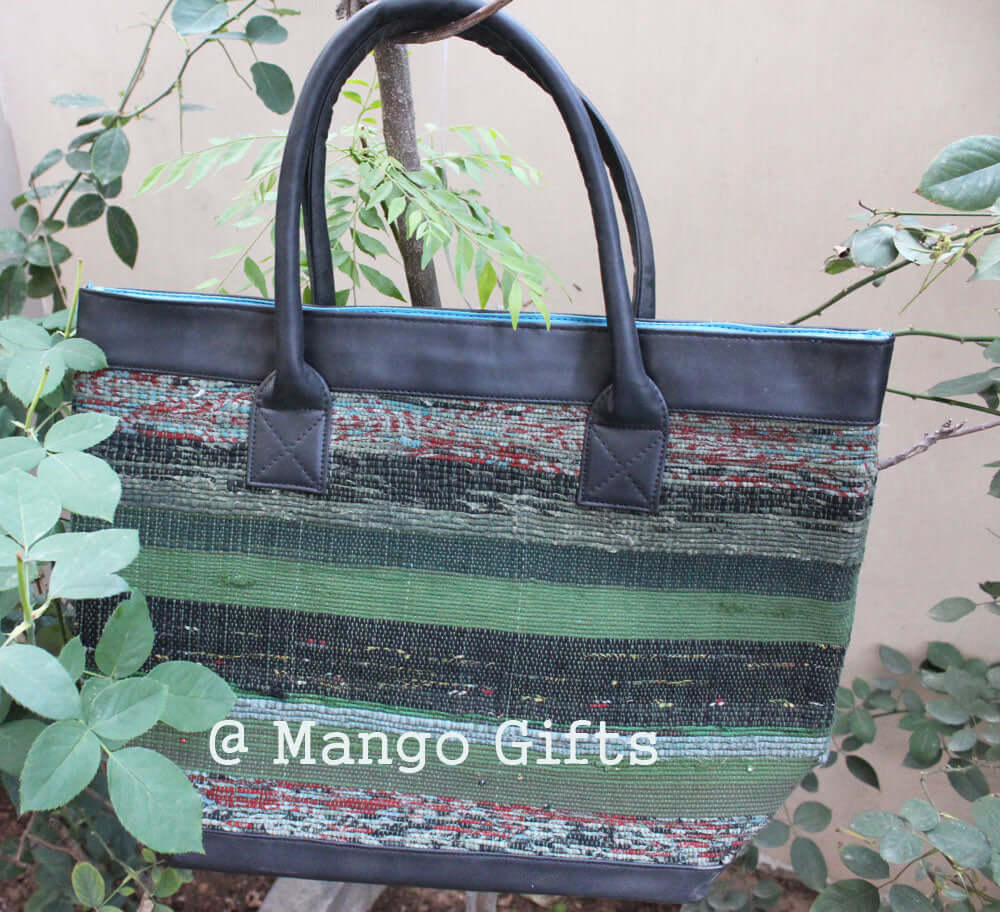 Stylish green cotton Kantha tote bag, perfect for shopping or picnics, featuring leather straps and two inside pockets.