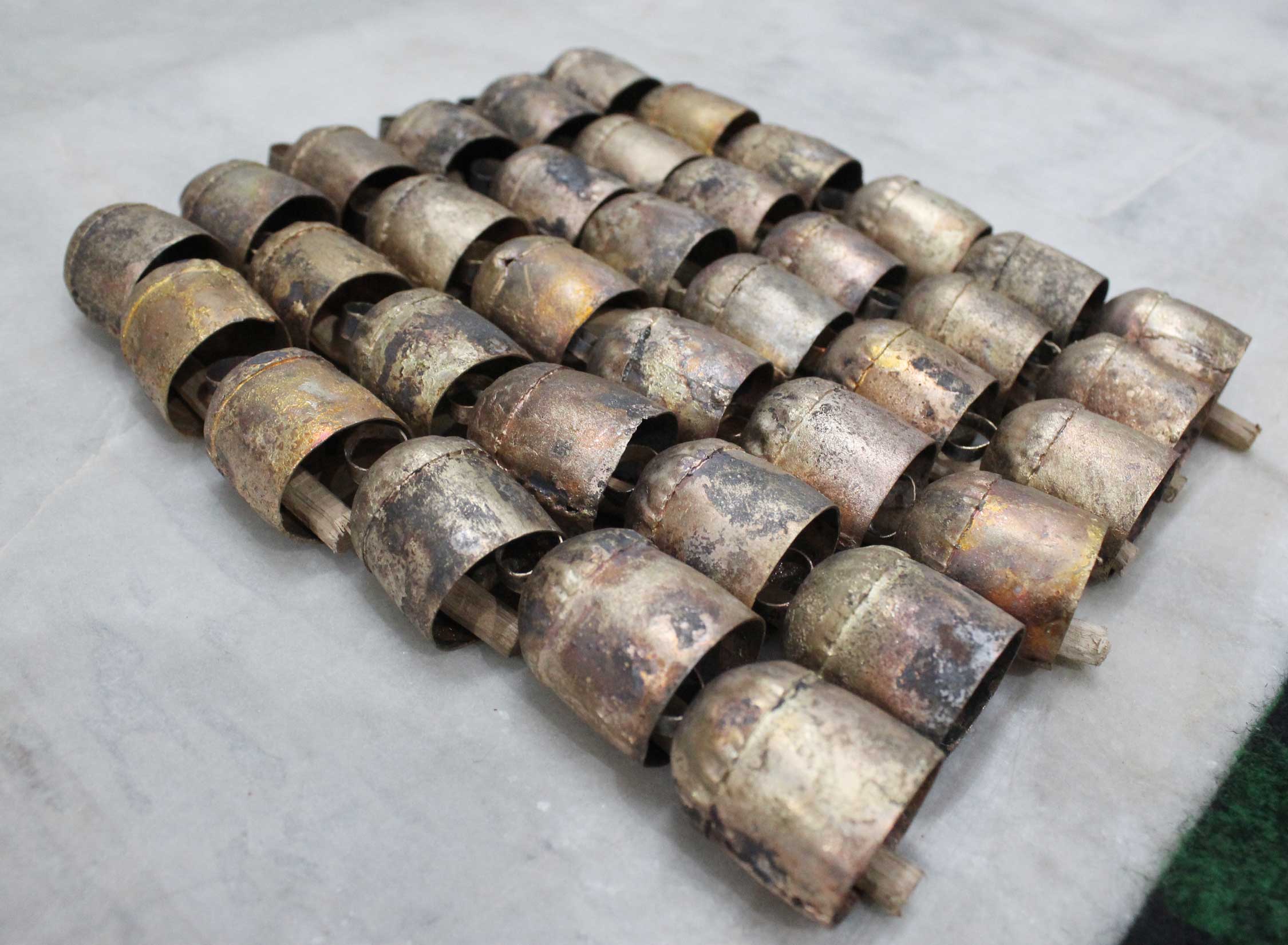 Explore our unique 2" rustic tin bells made from recycled iron with a vintage finish. Perfect for DIY projects and wall hanging decor!