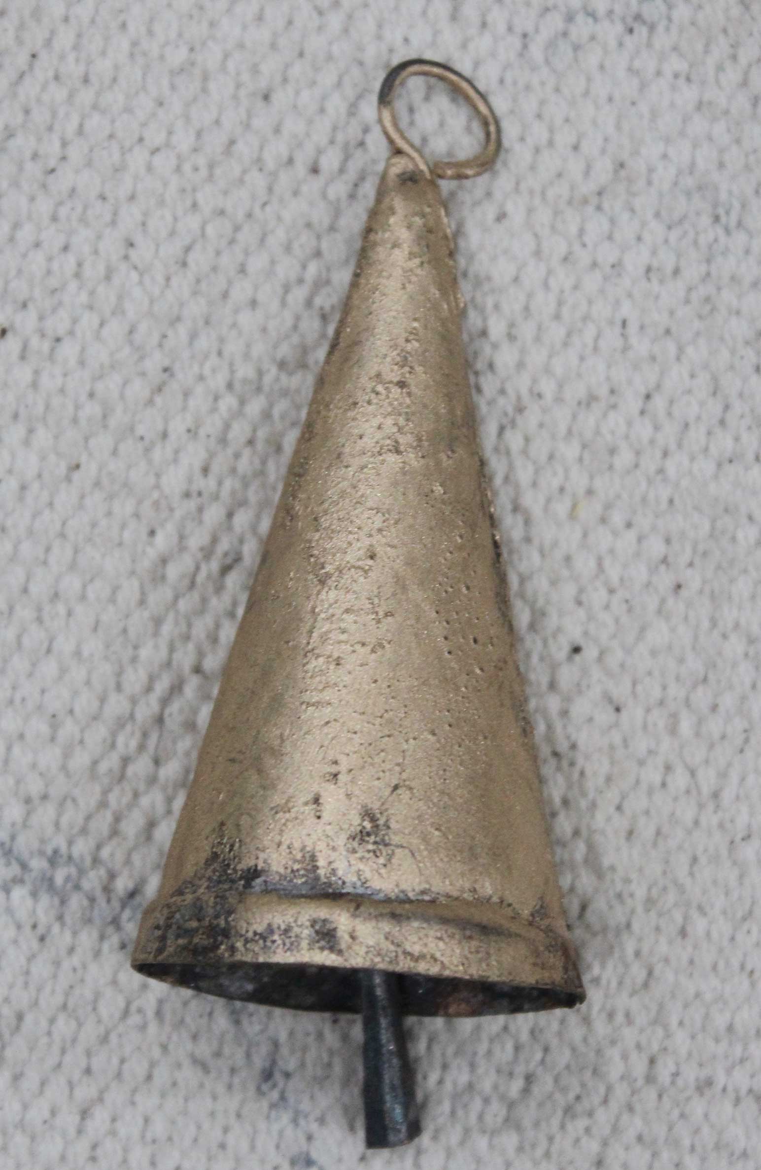 Handmade recycled iron cone bell in rustic golden finish, part of a decorative vintage set.