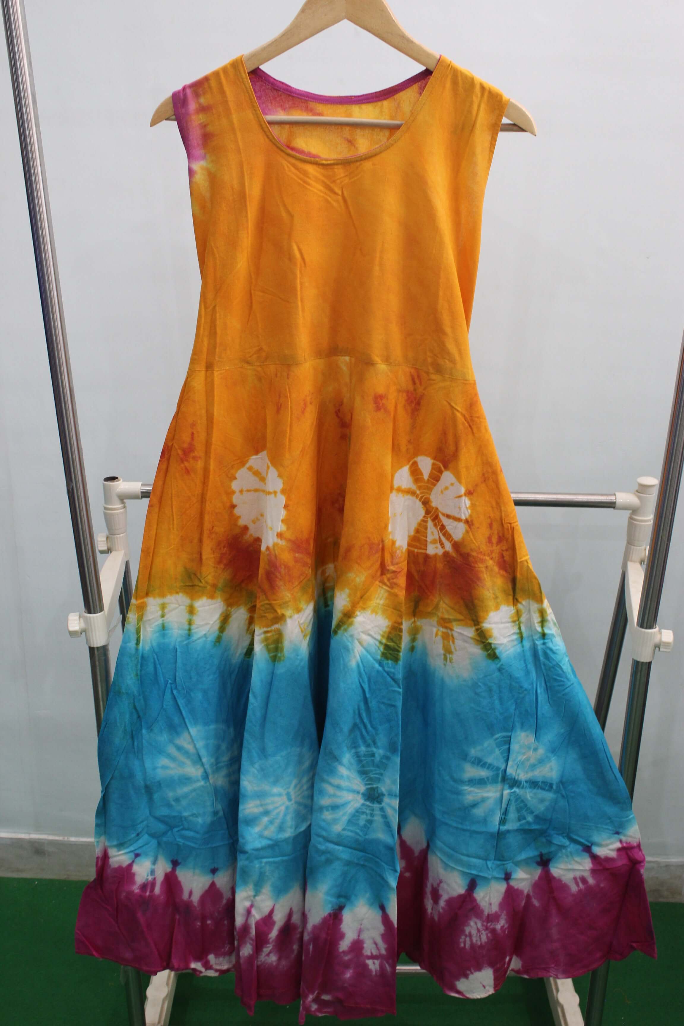 Colorful cotton tie-dye maxi dress in orange, blue, and purple, perfect for summer beach outings.