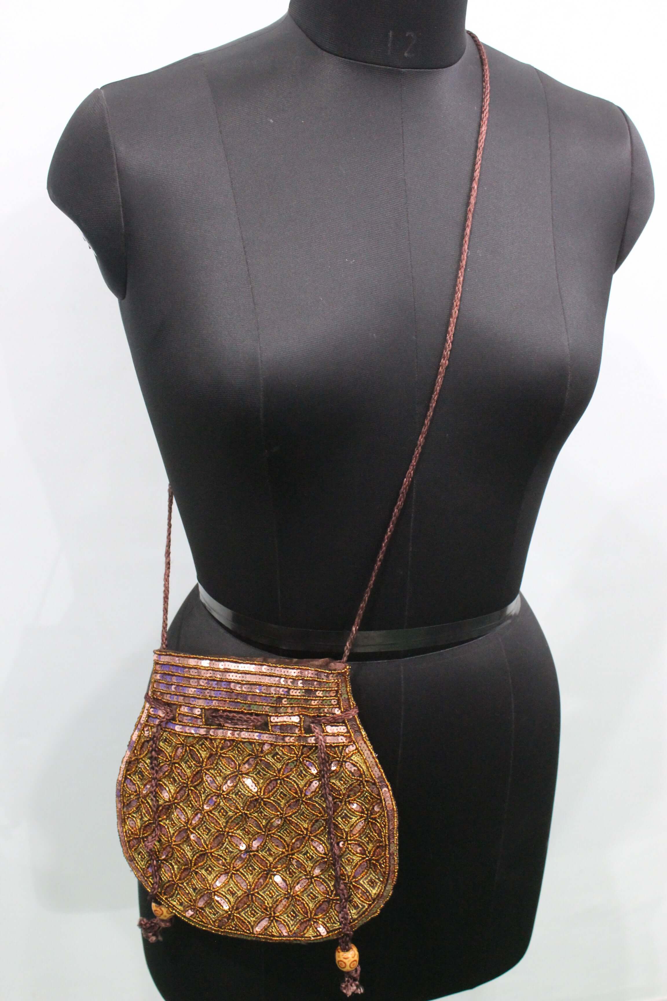 Elegant brown golden sequin potli bag displayed on a mannequin, perfect for formal occasions.
