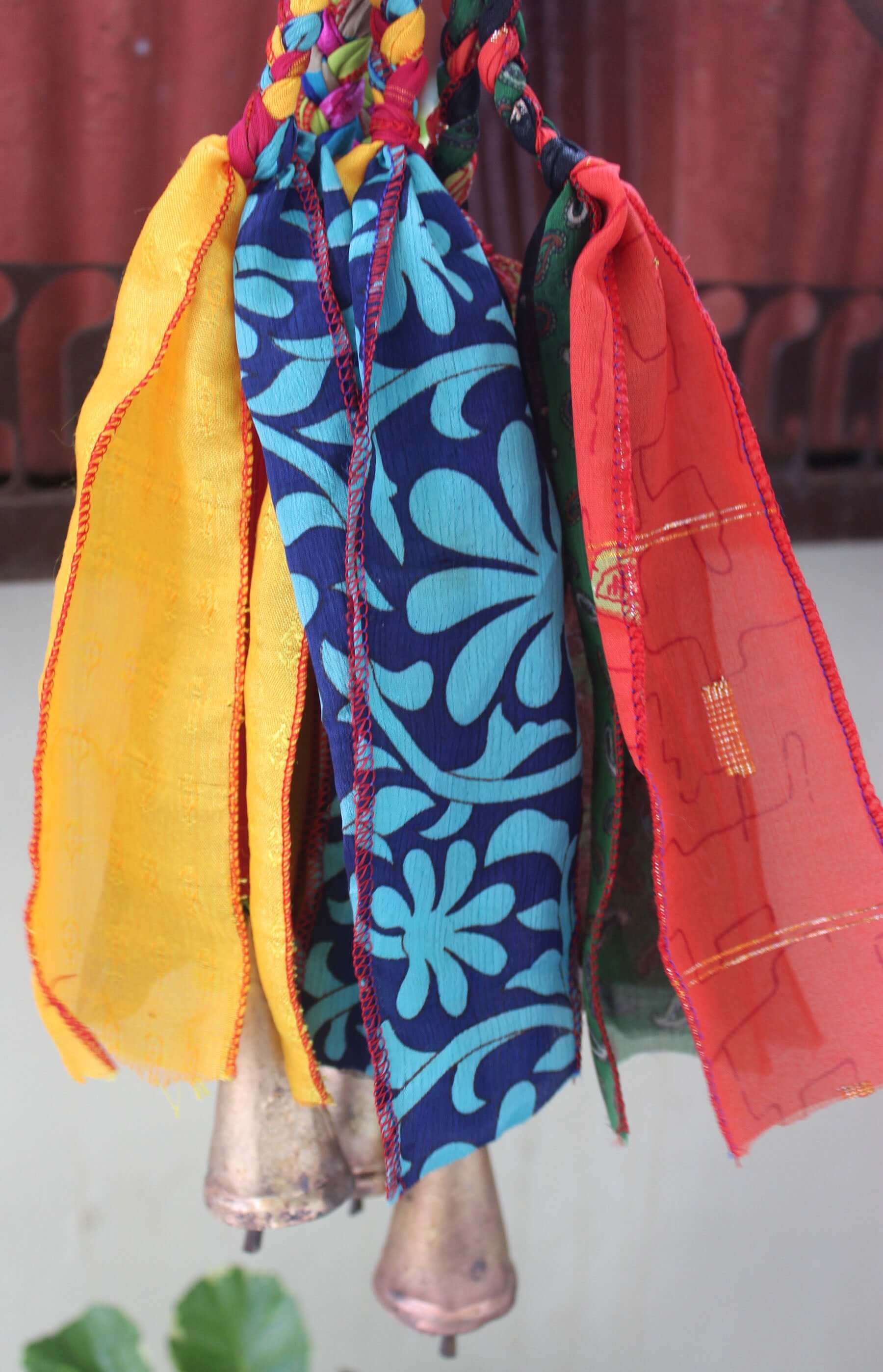 Shop our multi-color Heart Bells Windchime, handmade from recycled silk sari. Perfect for patios and parties. 24" of bohemian charm!