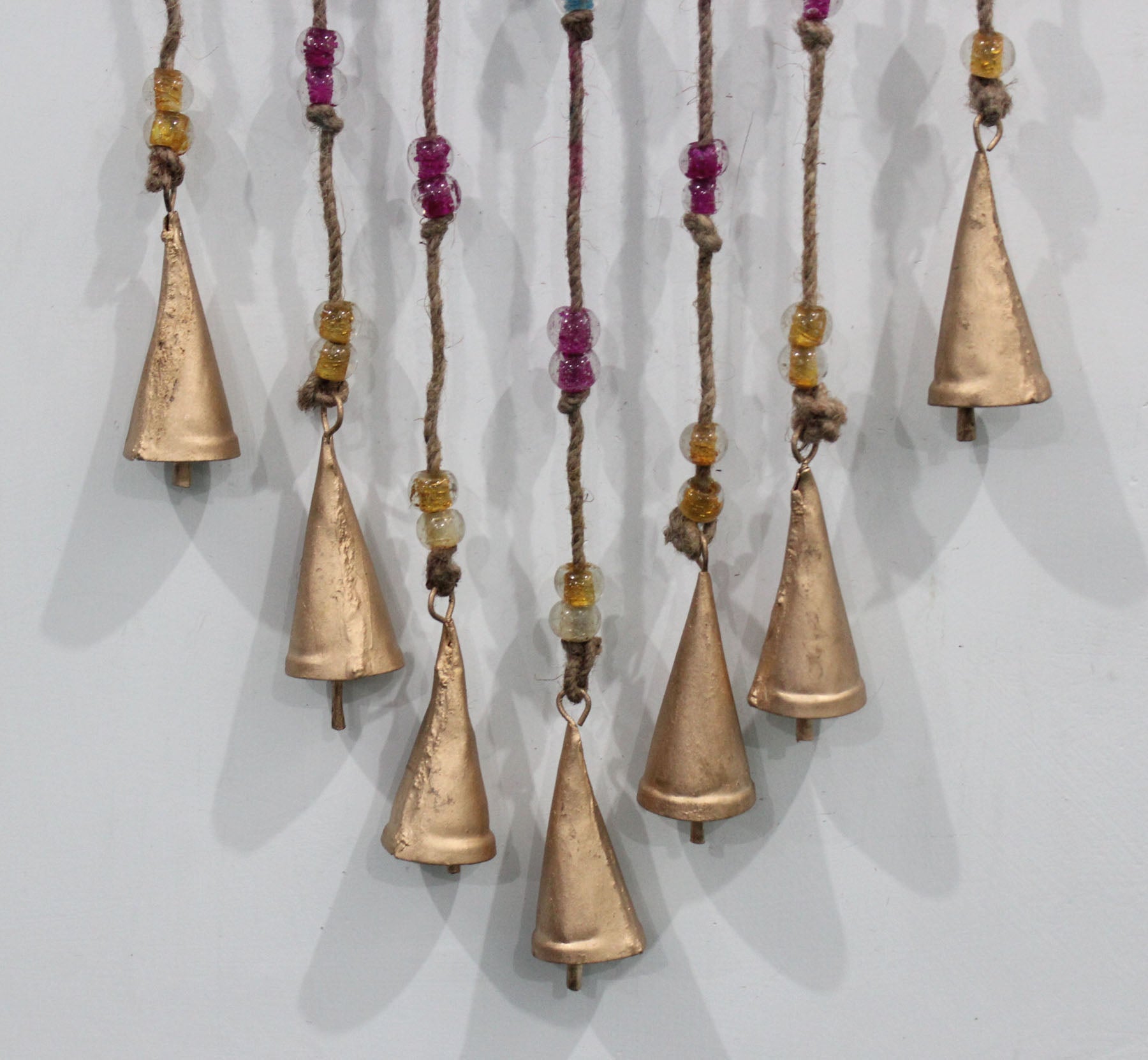 Charming recycled iron heart wind chime with colorful glass beads. Perfect for gifts or adding a loving touch to your patio.