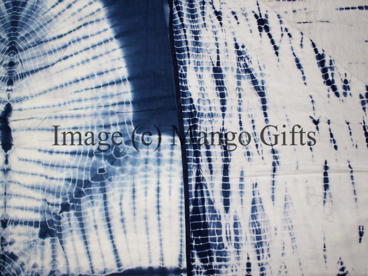 Blue tie dye quilt pattern showcasing intricate designs on soft cotton fabric.