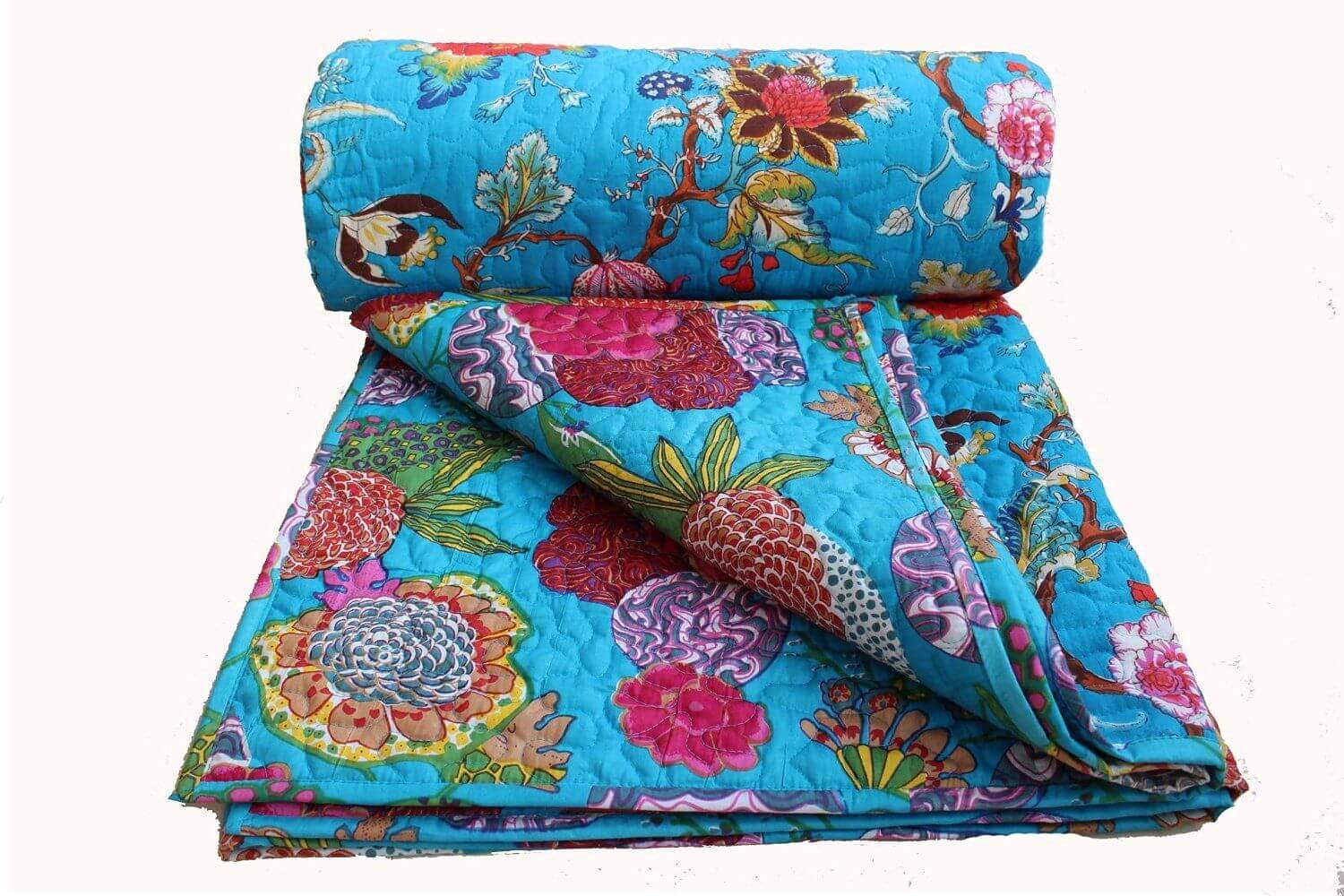 Bright blue floral reversible cotton quilt showcasing vibrant red and pink patterns, perfect for home decor.