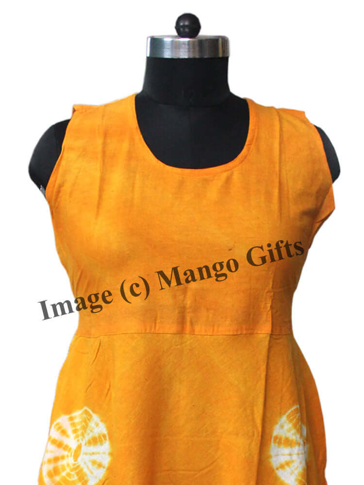 Close-up of a bright yellow cotton dress featuring a scoop neckline and decorative patterns, perfect for summer wear.